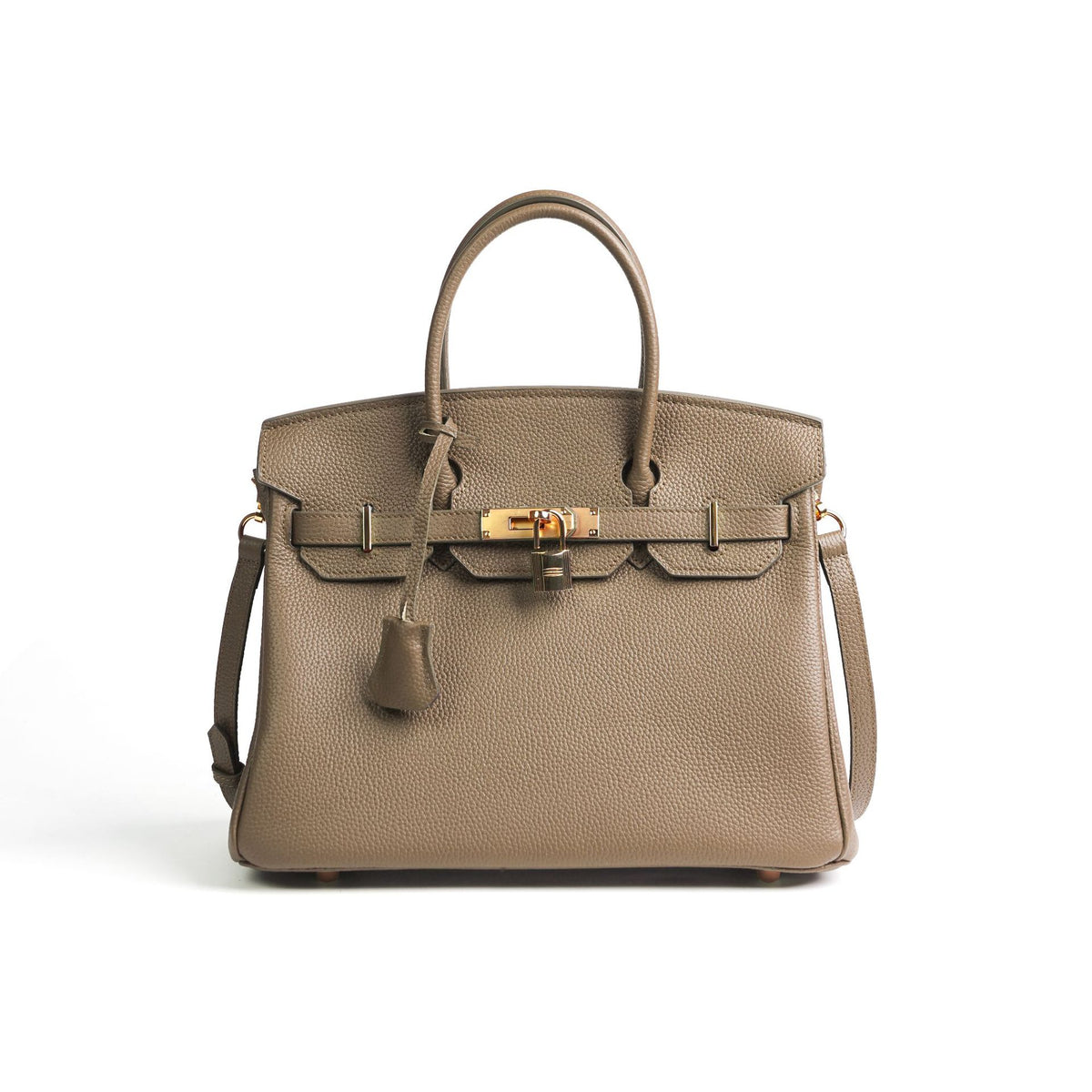 Taupe handbag with gold hardware on a white background