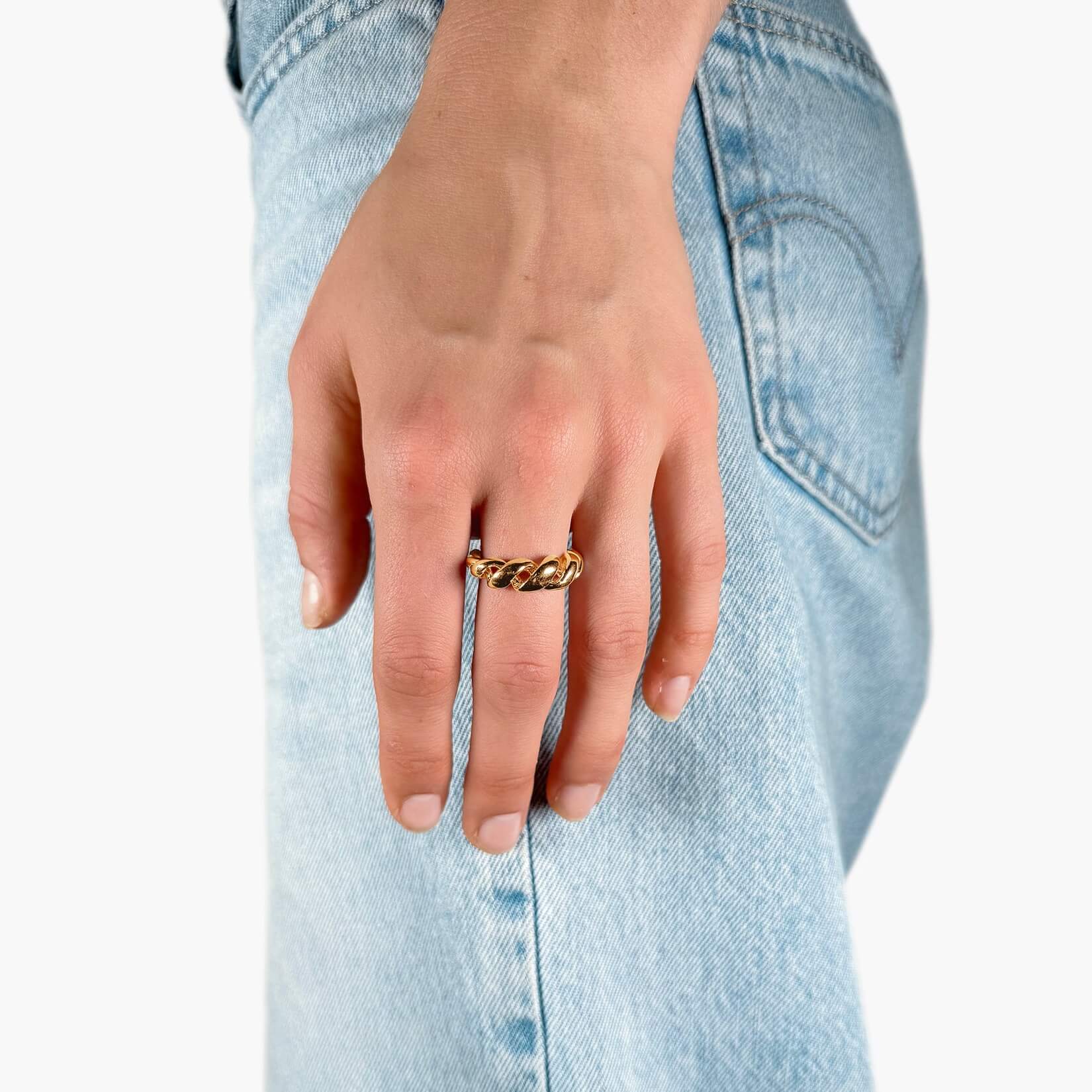 model wearing big twisted croissant ring gold