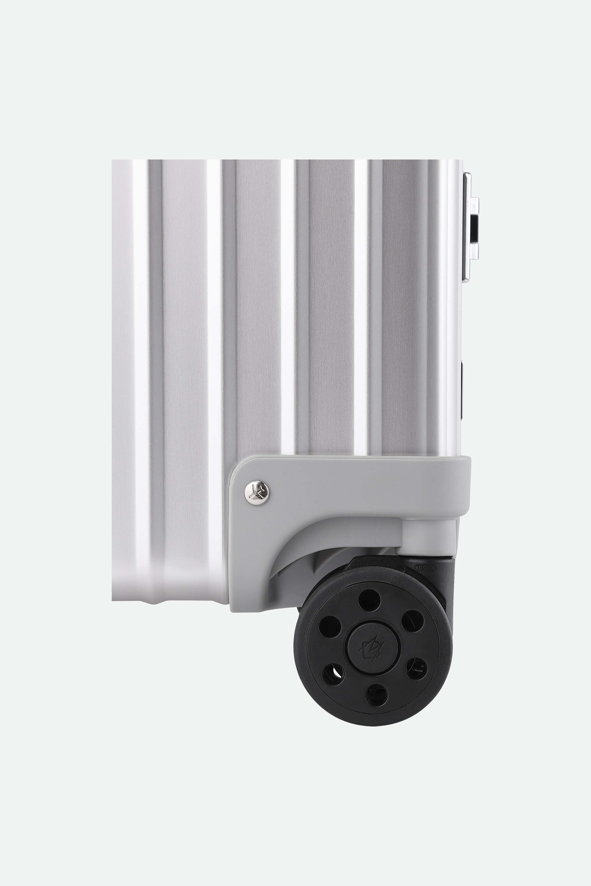 White vertical radiator with a black valve on a white background