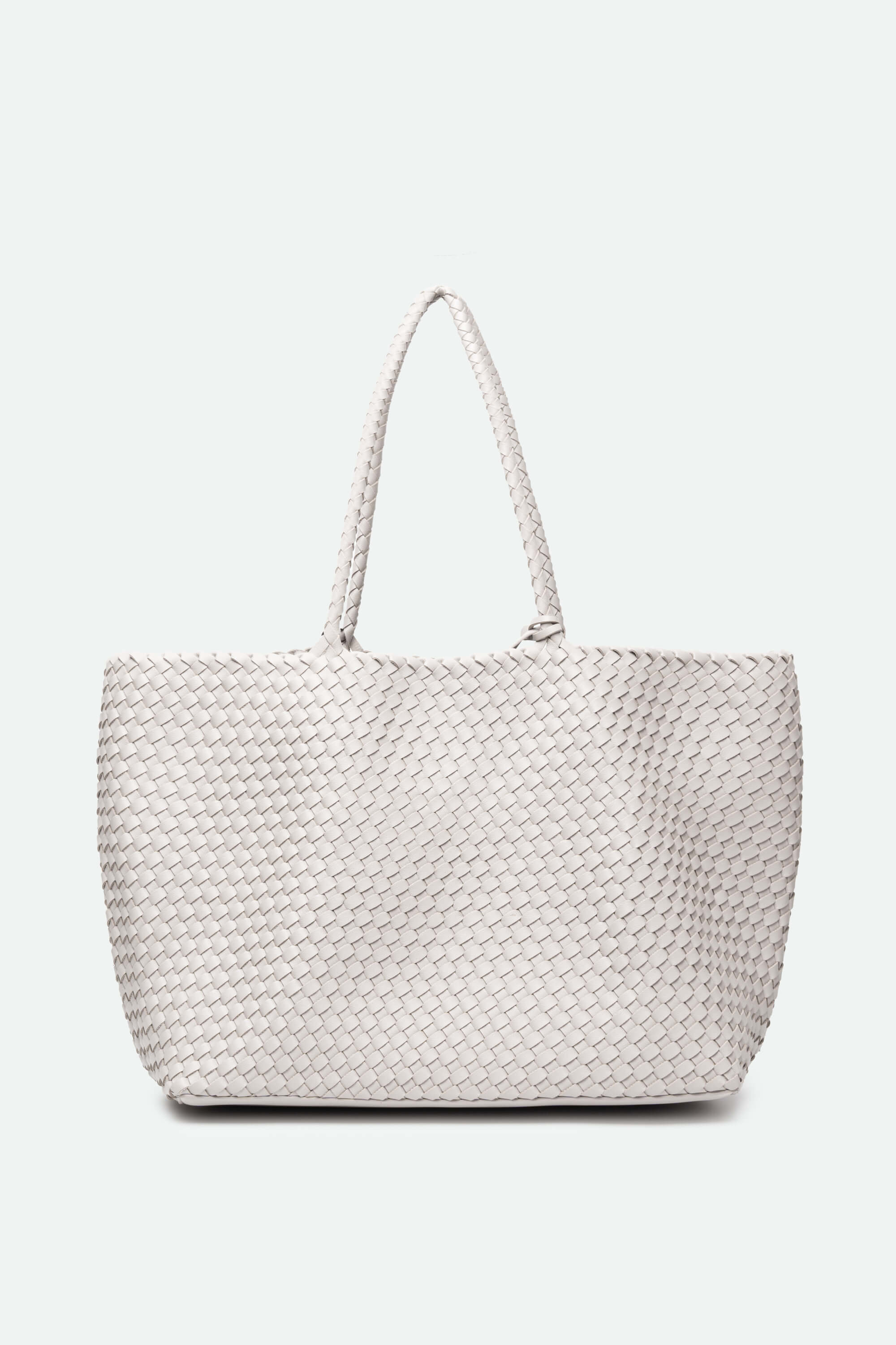 White woven handbag on a white background