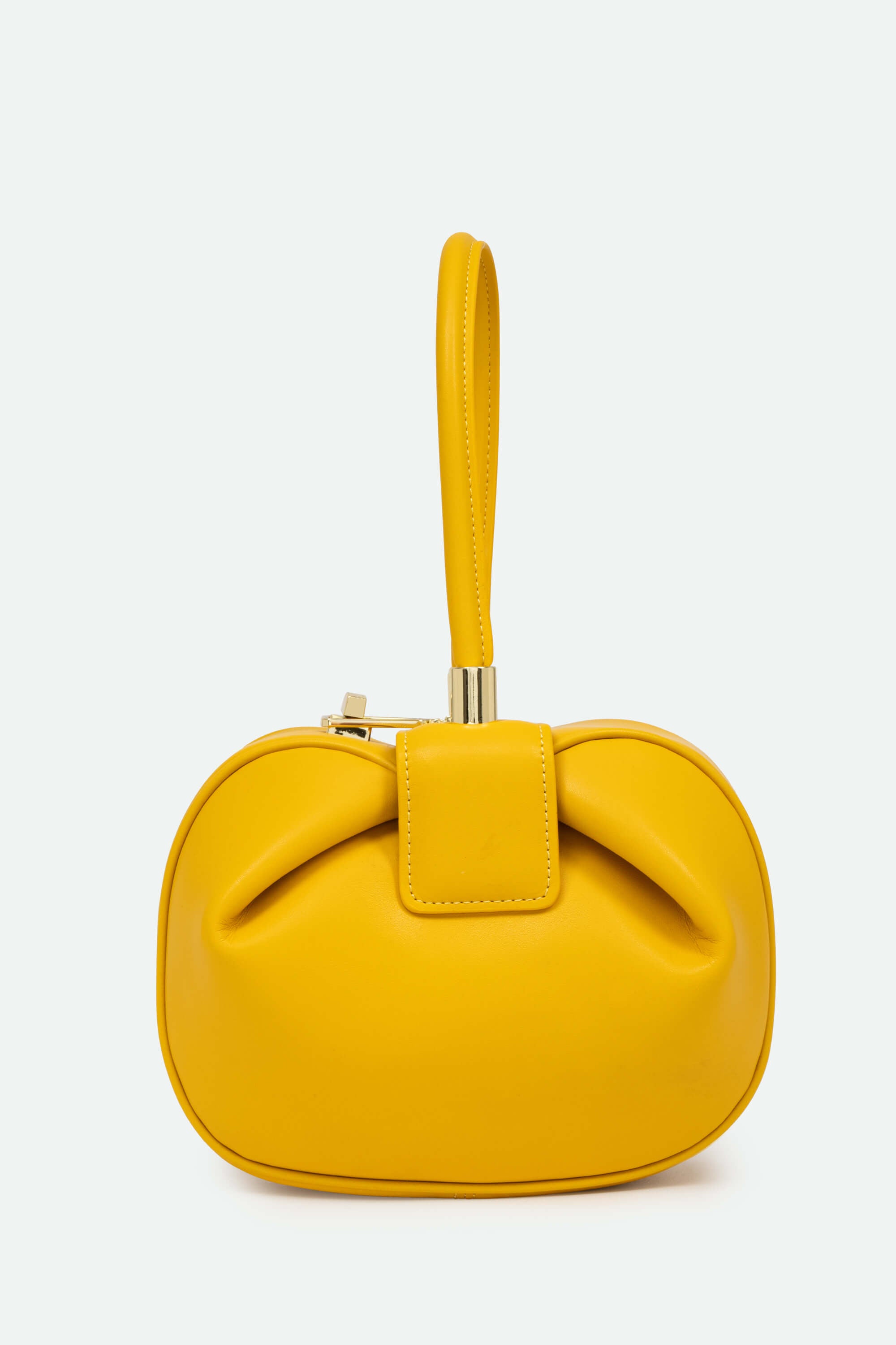 Yellow handbag with a bow detail on a white background