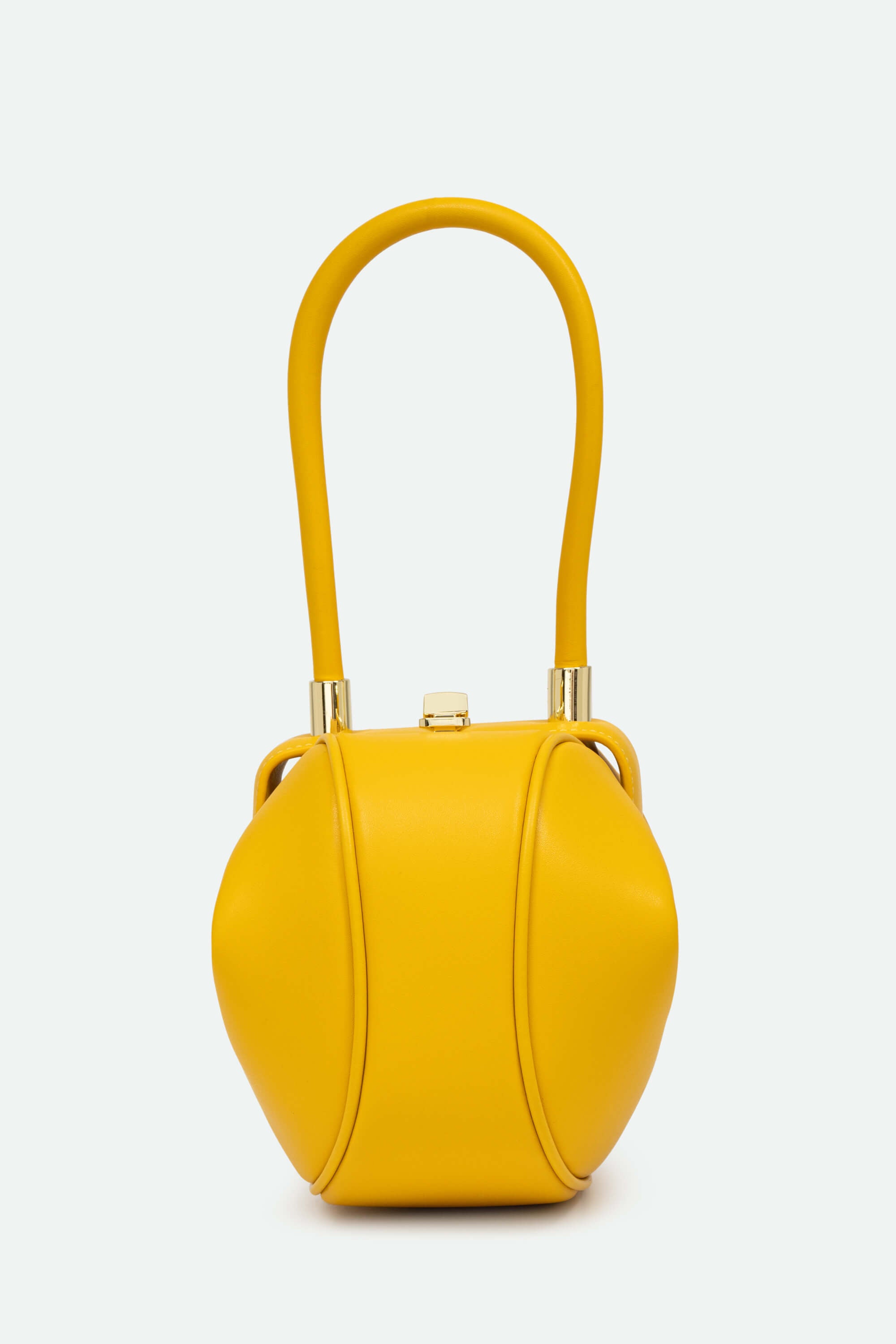 Yellow handbag with gold accents on a white background