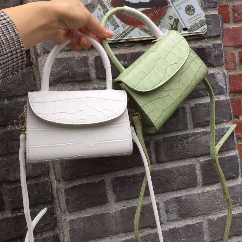 Two white and green mini crossbody bags