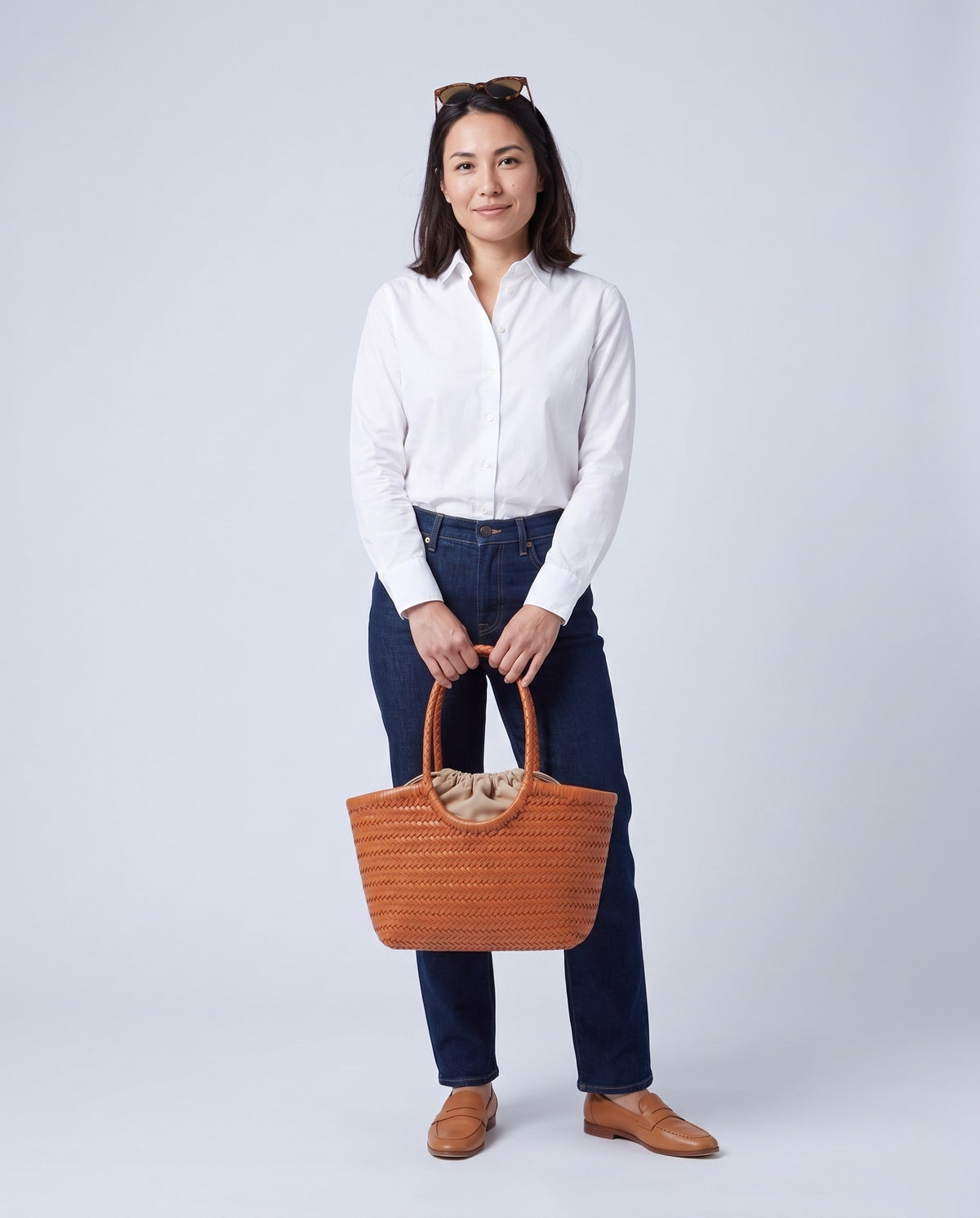 Model carrying the Alghero woven leather tote in Cognac – full length