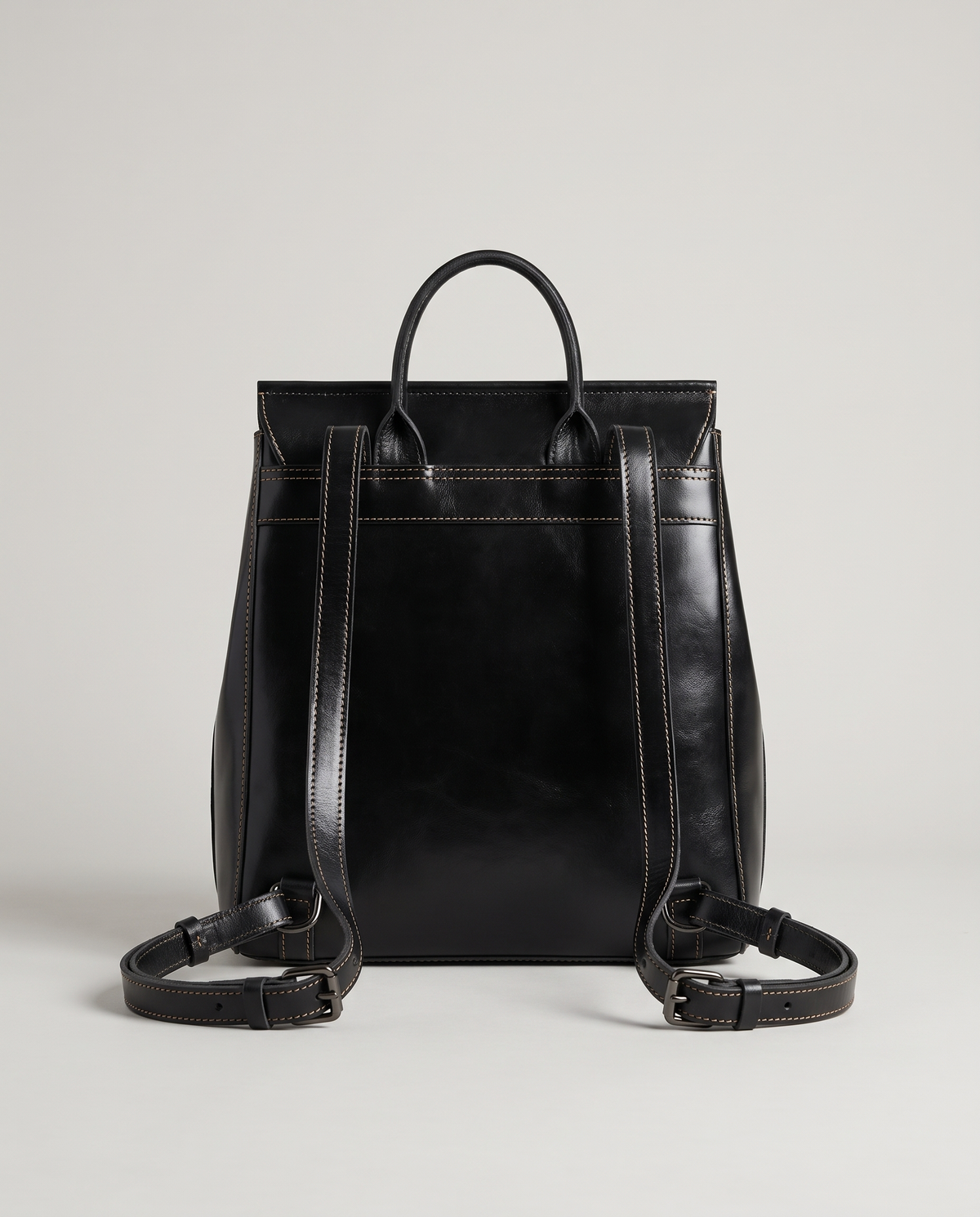 Ambler waxed leather backpack in Black – back view showing the shoulder straps