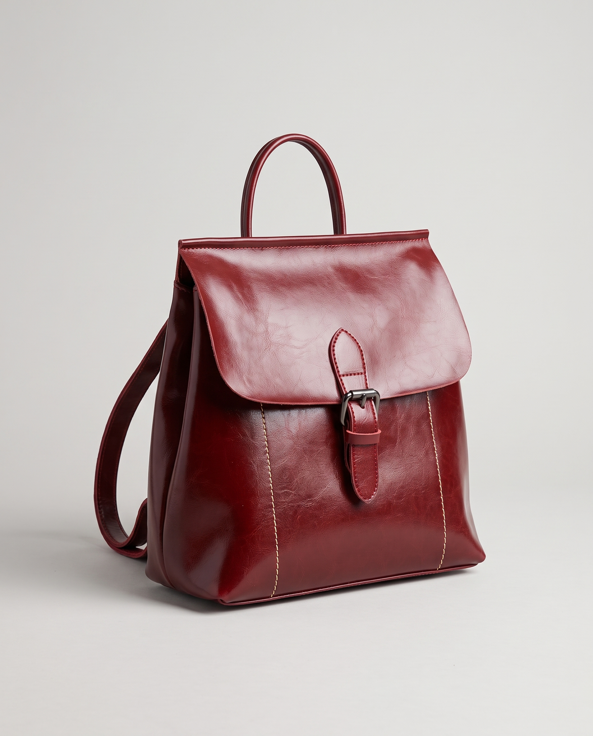 Ambler waxed leather backpack in Red – three-quarter view