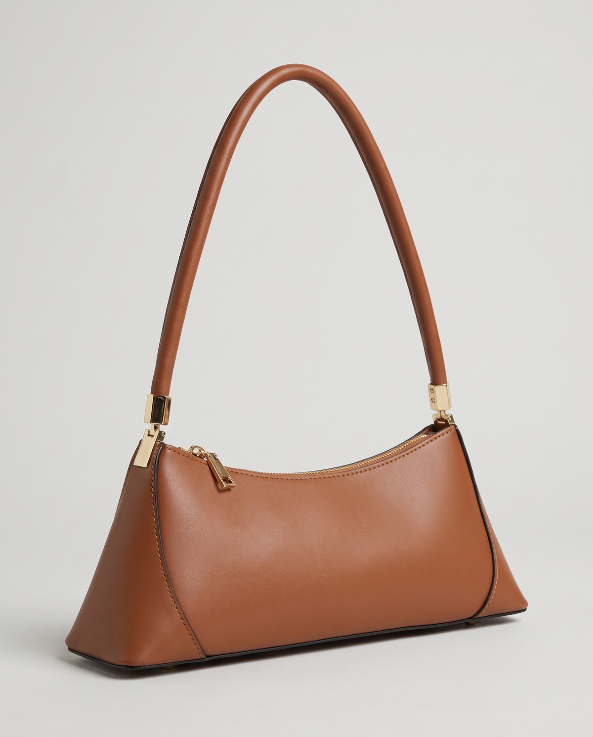Arc leather shoulder bag in Brown – three-quarter view