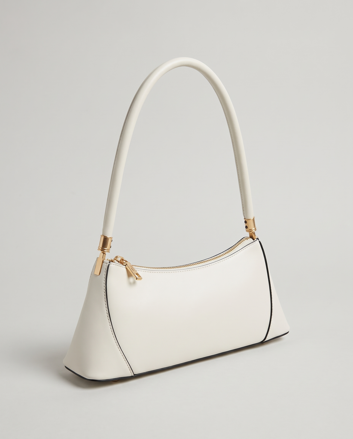 Arc leather shoulder bag in Chalk – three-quarter view