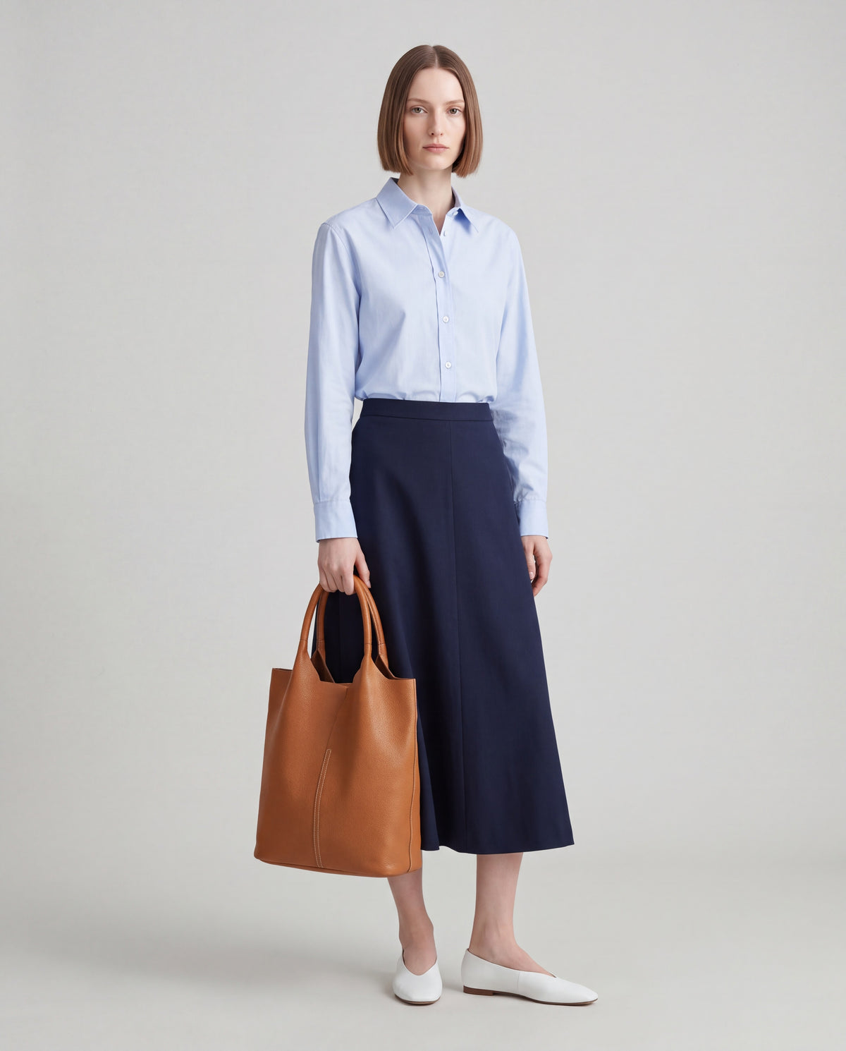 Arco bag in Caramel – worn by model, full length