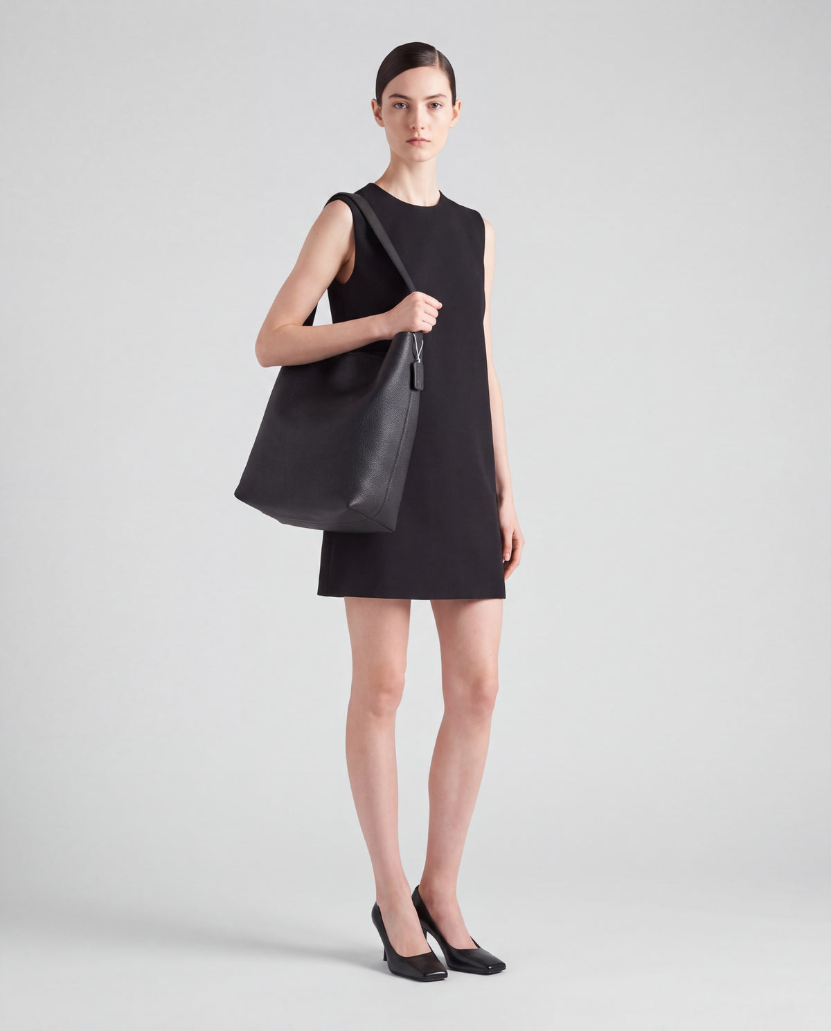 Aria Large bag in Black – worn by model, full length