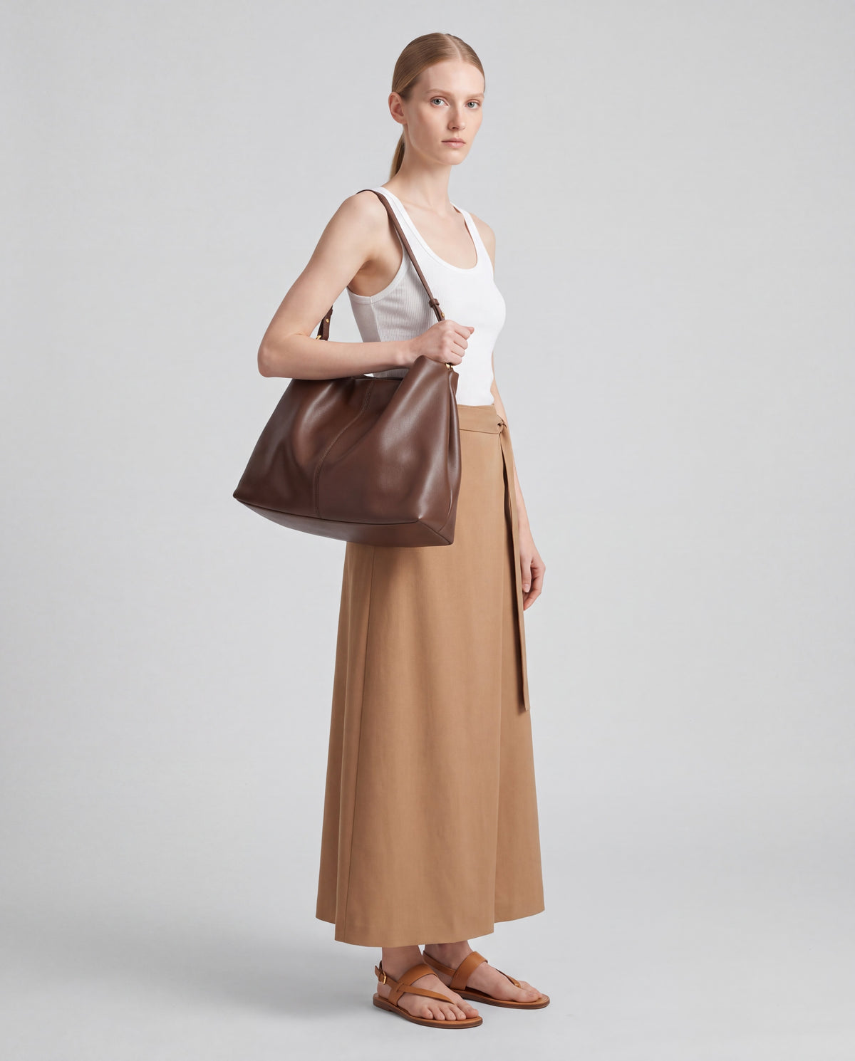 Assisi bag in Brown – worn by model, full length