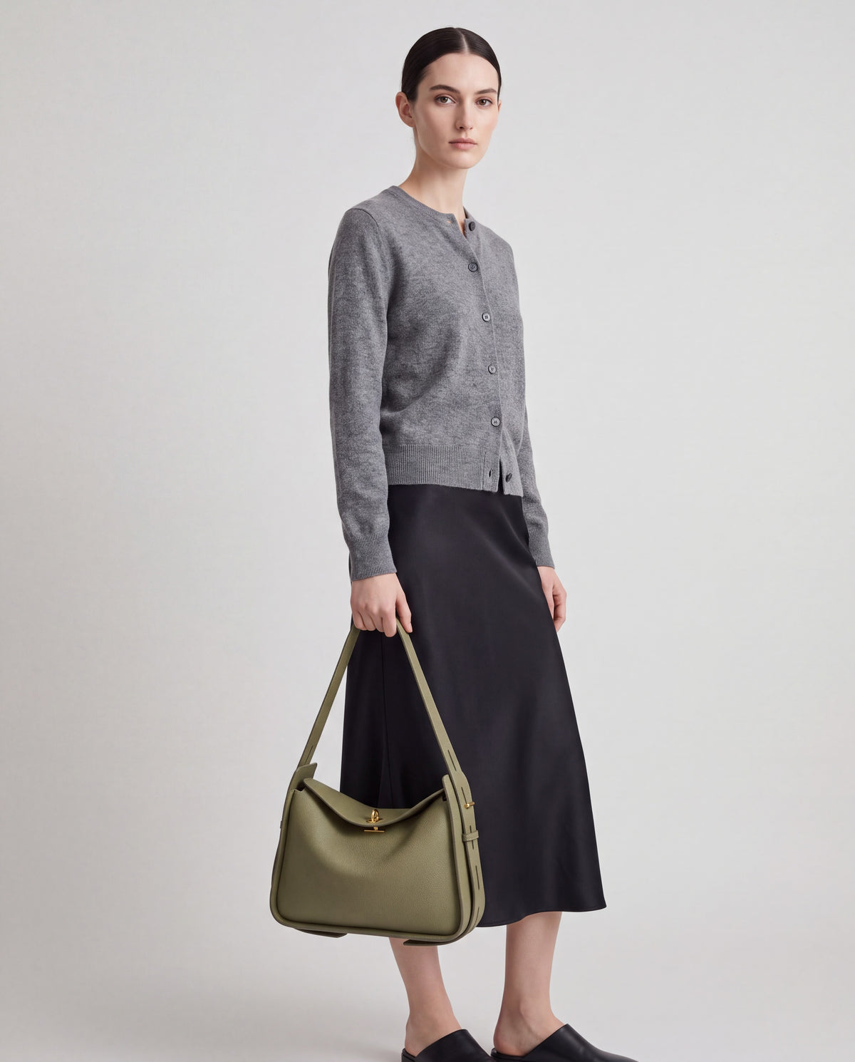 Asti bag in Sage – worn by model, close-up