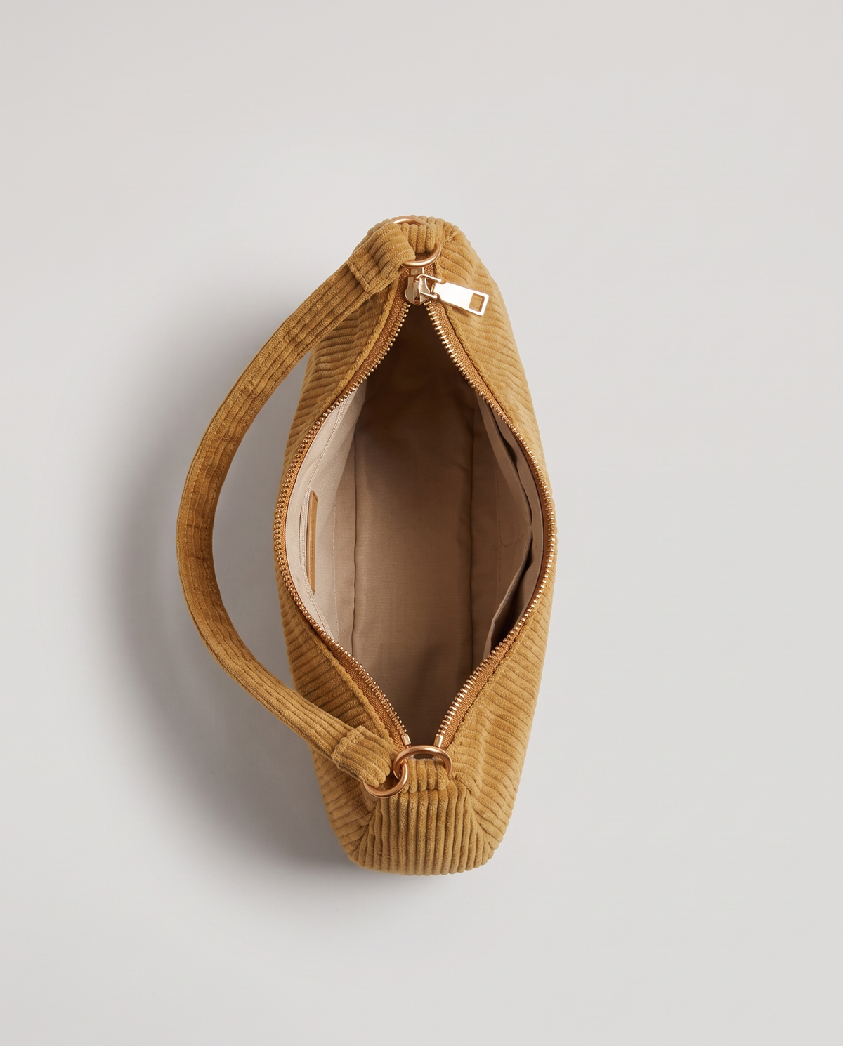 Aura corduroy shoulder bag in Tan – view from above with the zip open