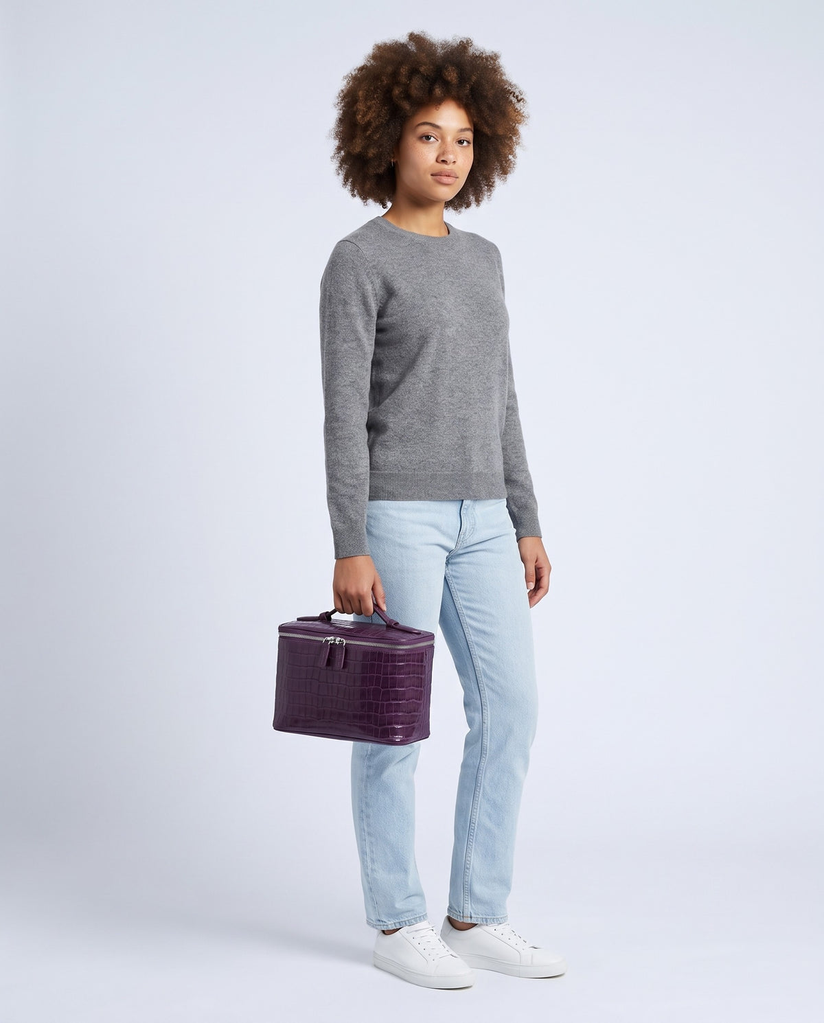 Model holding the Bellagio vanity case in Purple – full-length view