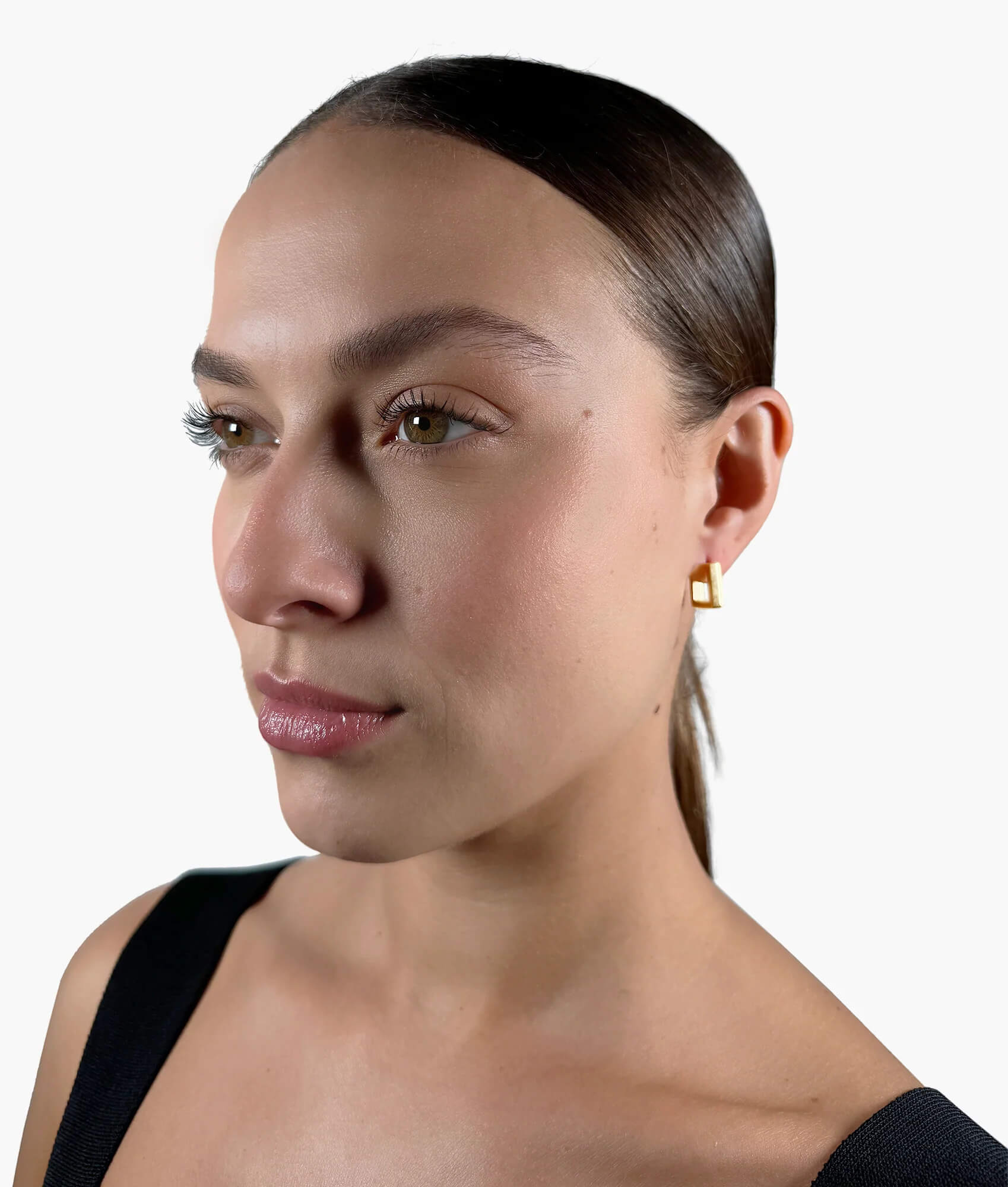 Model wearing Block Hoop Earrings gold