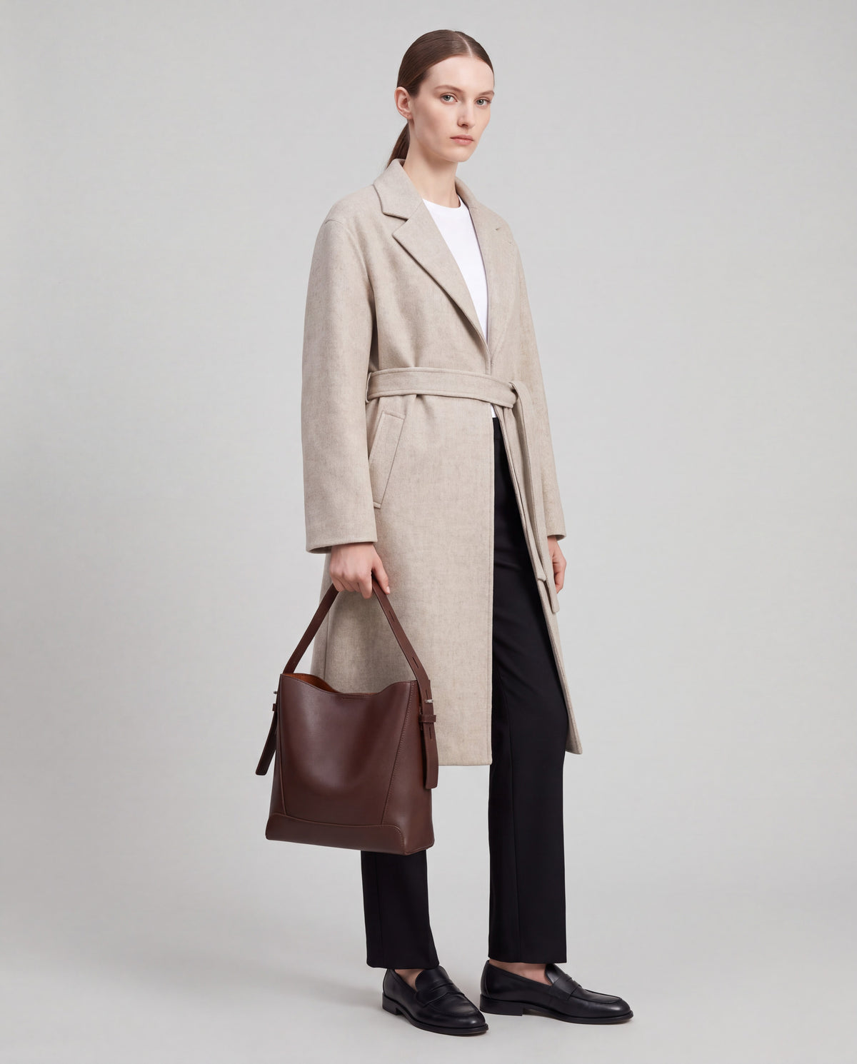 Calce bag in Chocolate – worn by model, close-up