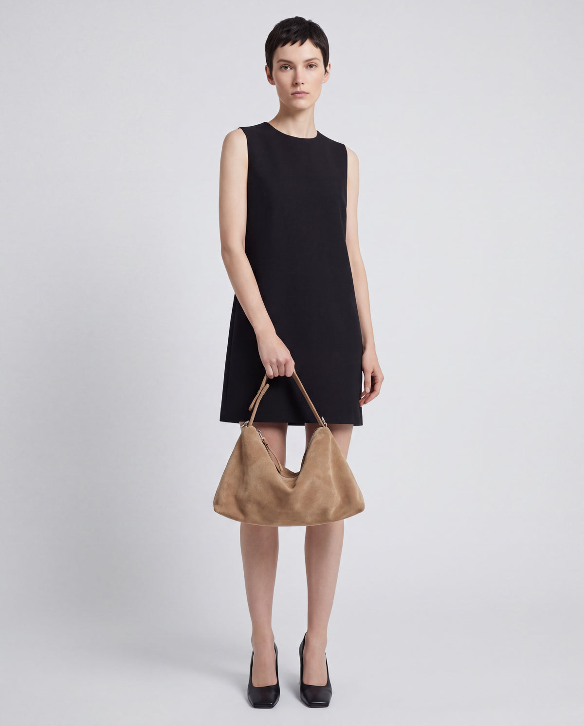 Calma bag in Beige – worn by model, close-up