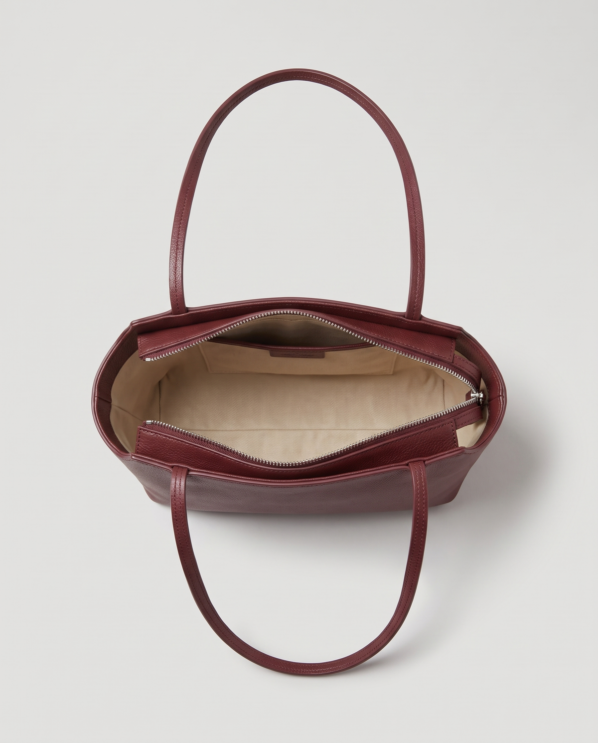 Capri leather shoulder bag in burgundy, open showing interior
