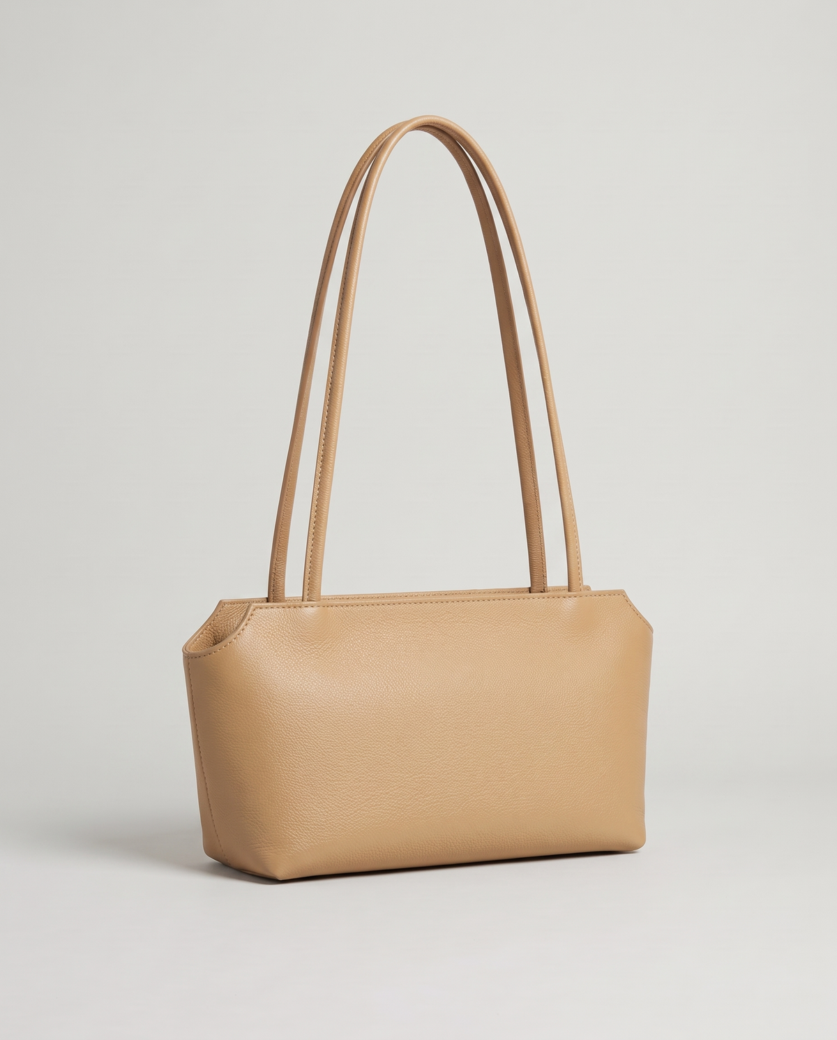 Capri leather shoulder bag in tan, three-quarter view