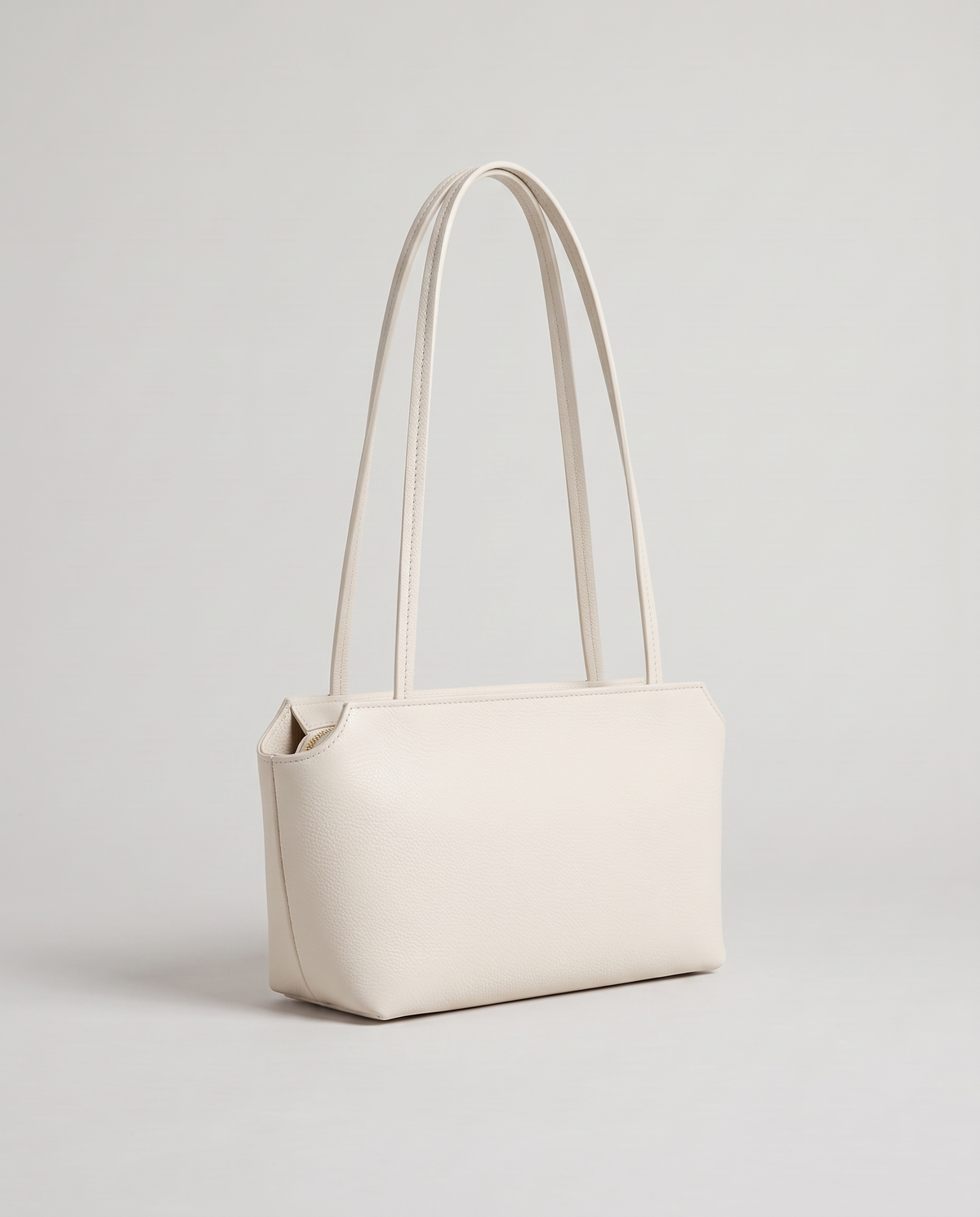 Capri leather shoulder bag in white, three-quarter view