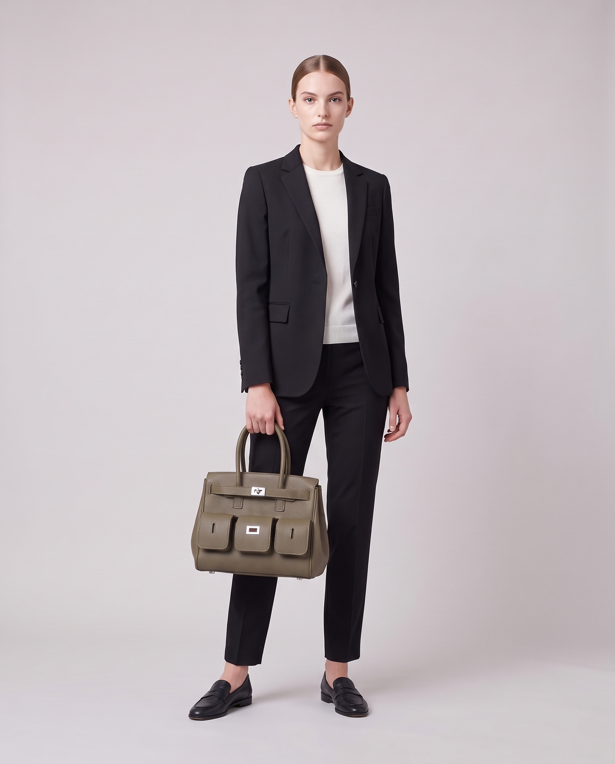 Model carrying the Capua leather tote in Mocha – full length