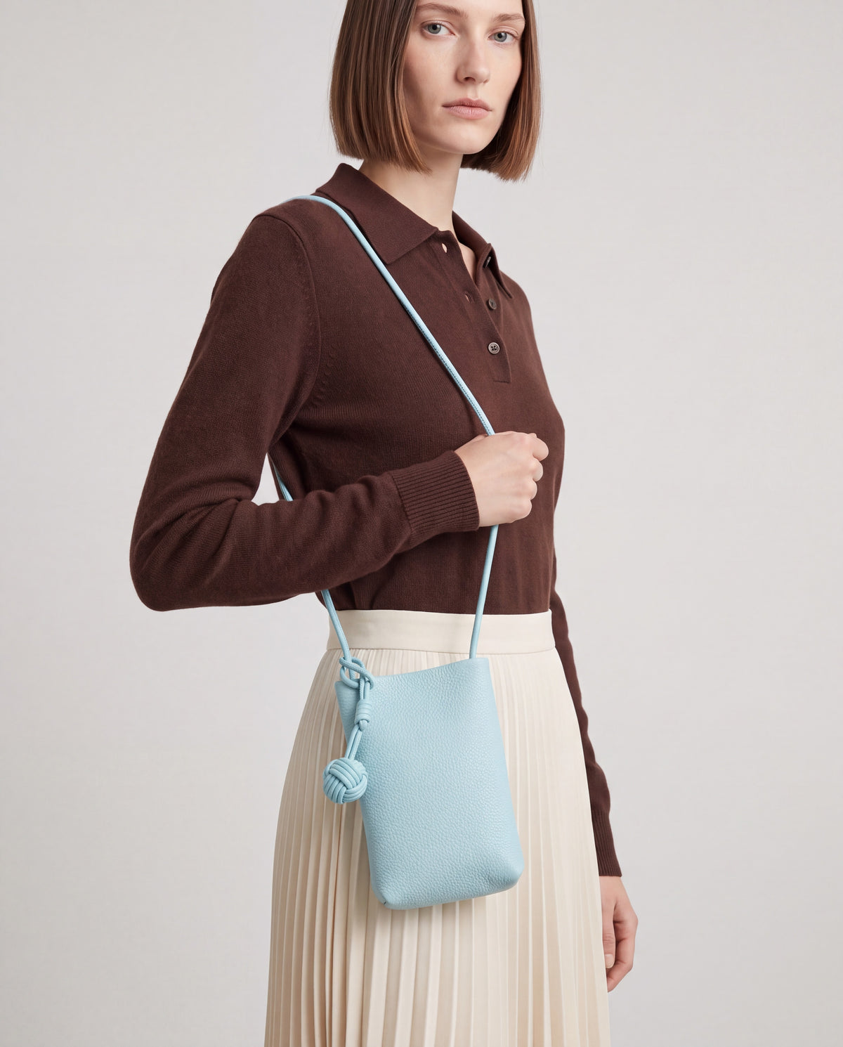 Cara bag in Sky – worn by model, close-up