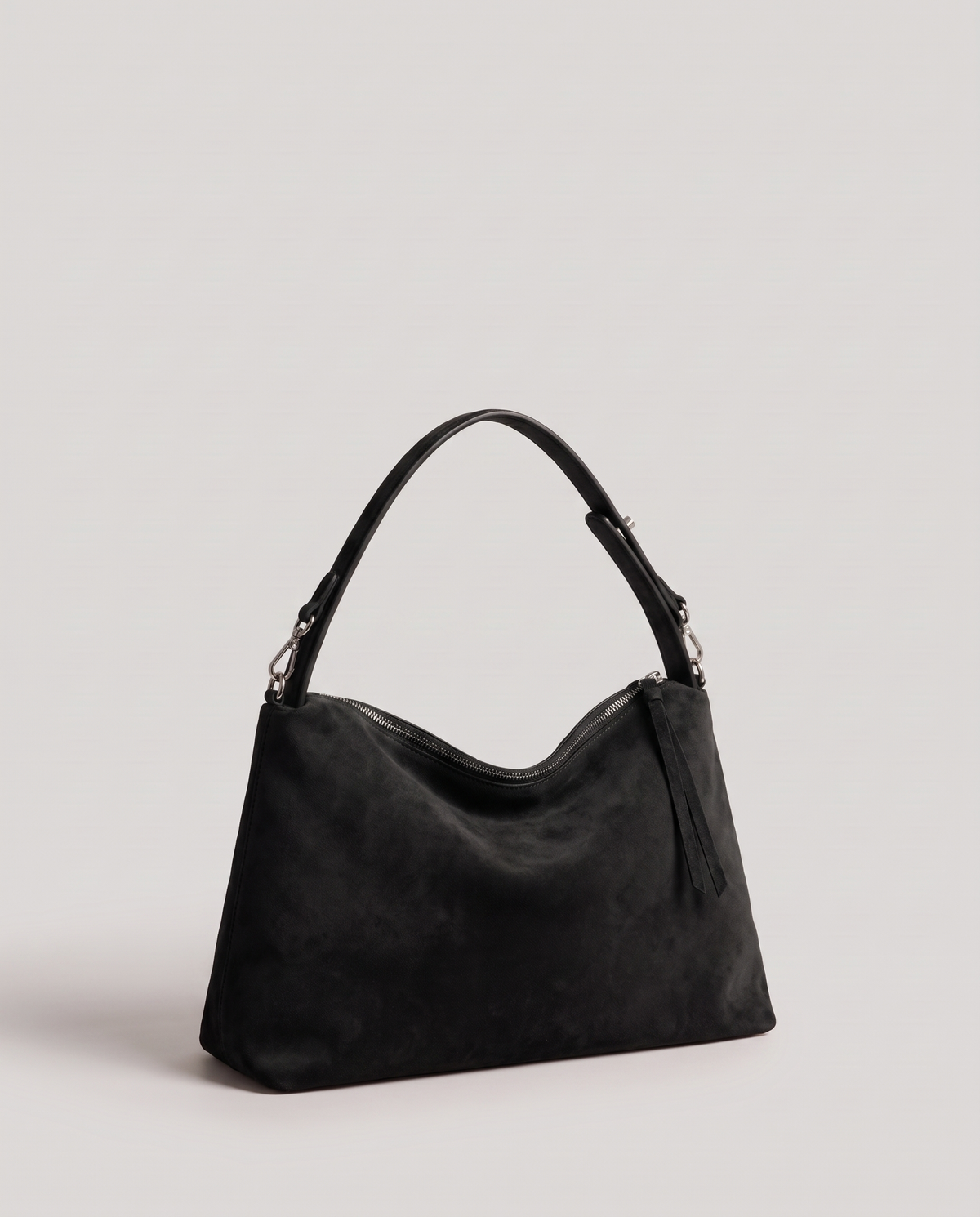 Cima suede shoulder bag in black, three-quarter view