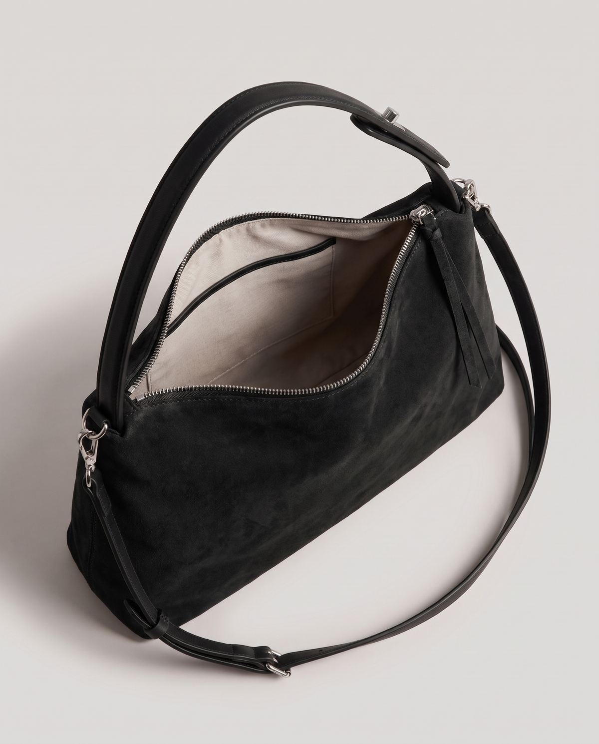Cima suede shoulder bag in black, open showing interior