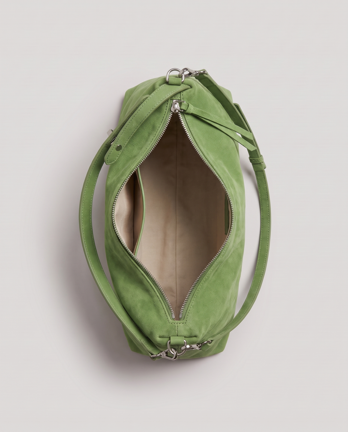 Cima suede shoulder bag in green, open showing interior