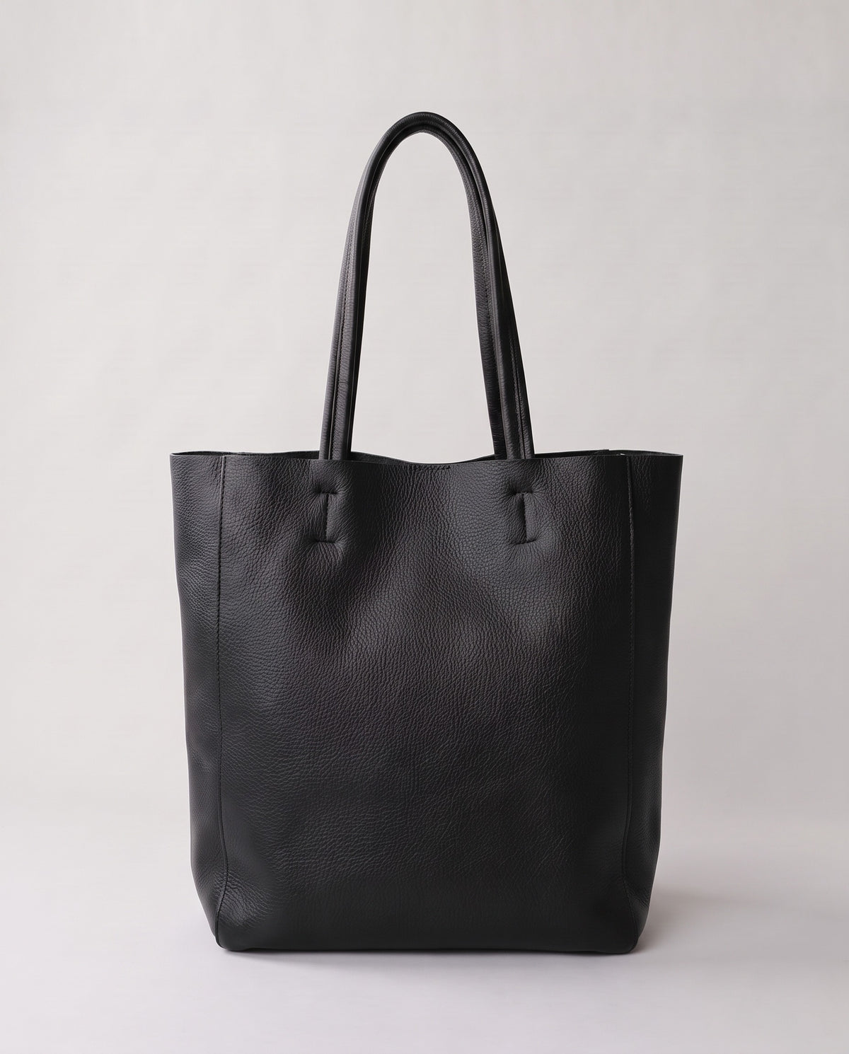Costa leather tote in black, back view