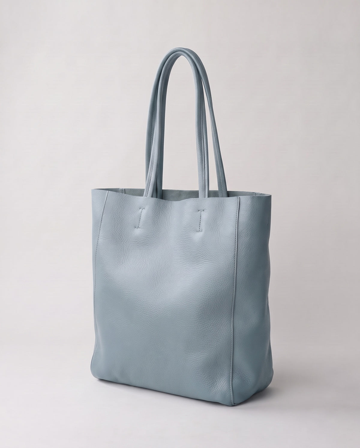Costa leather tote in blue, three-quarter view