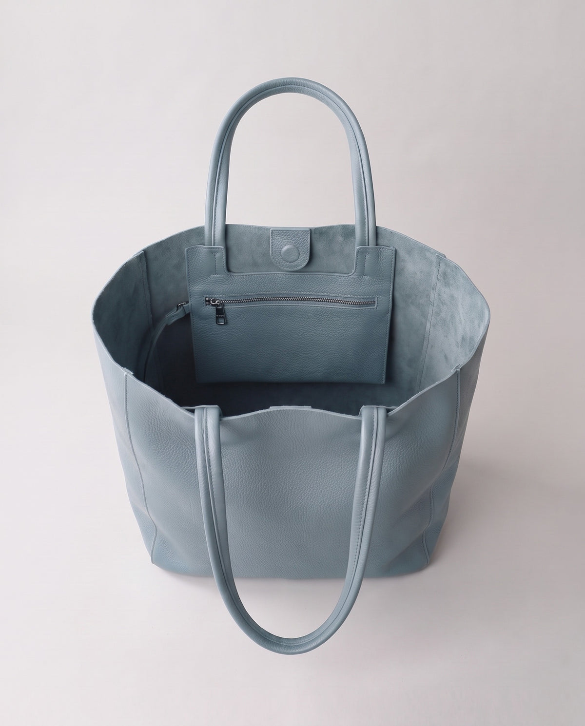 Costa leather tote in blue, open showing interior