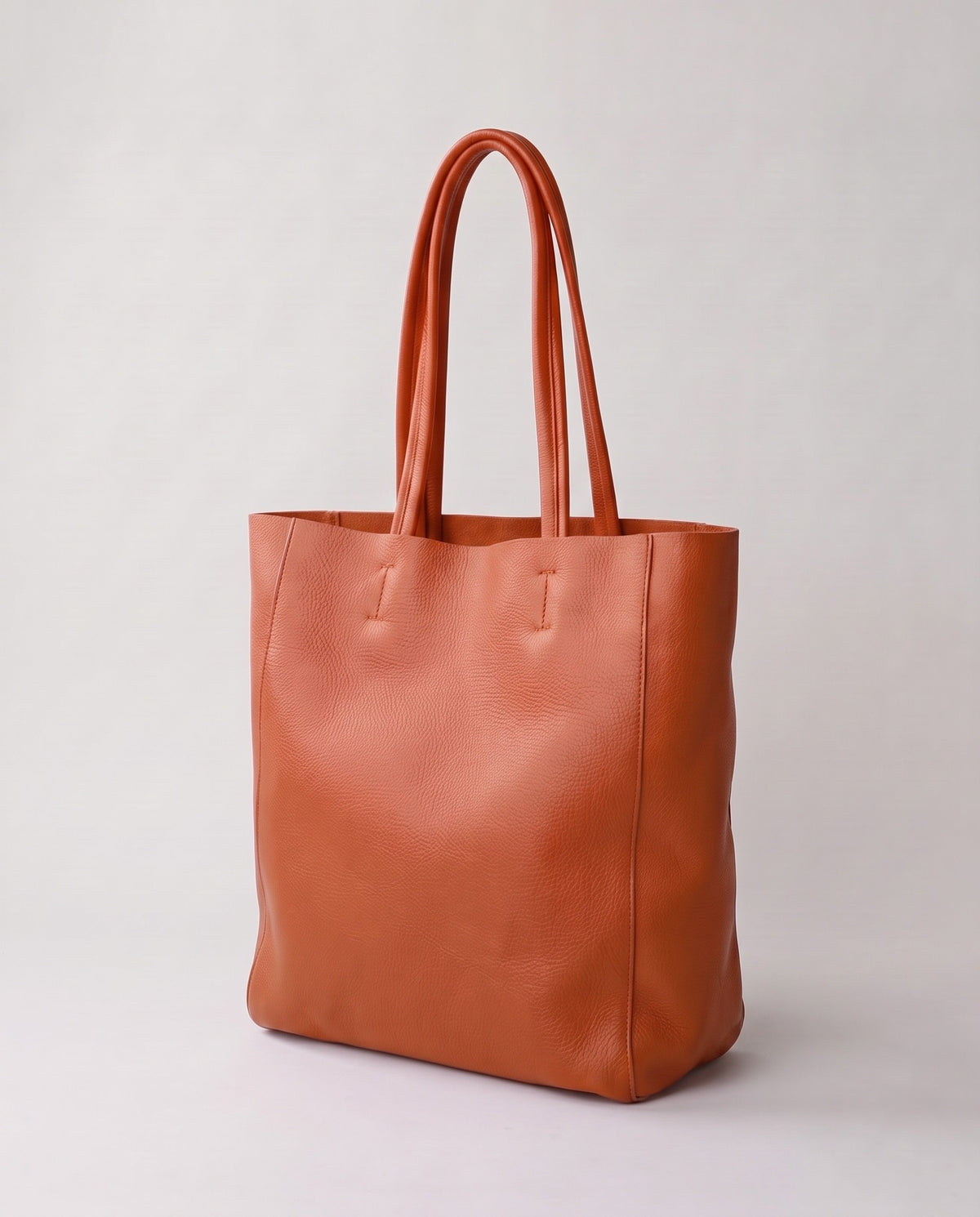Costa leather tote in caramel, three-quarter view