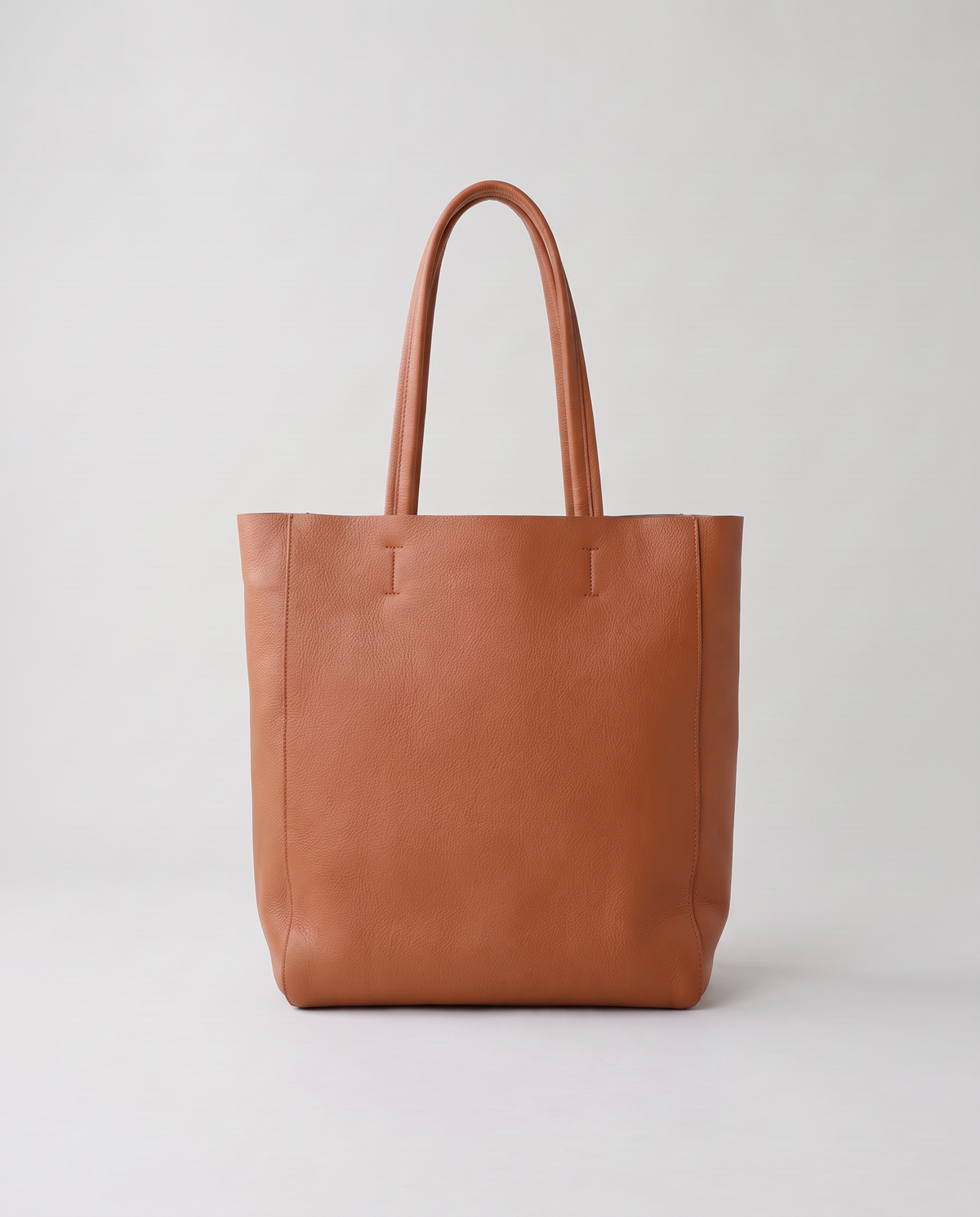 Costa leather tote in cognac, back view