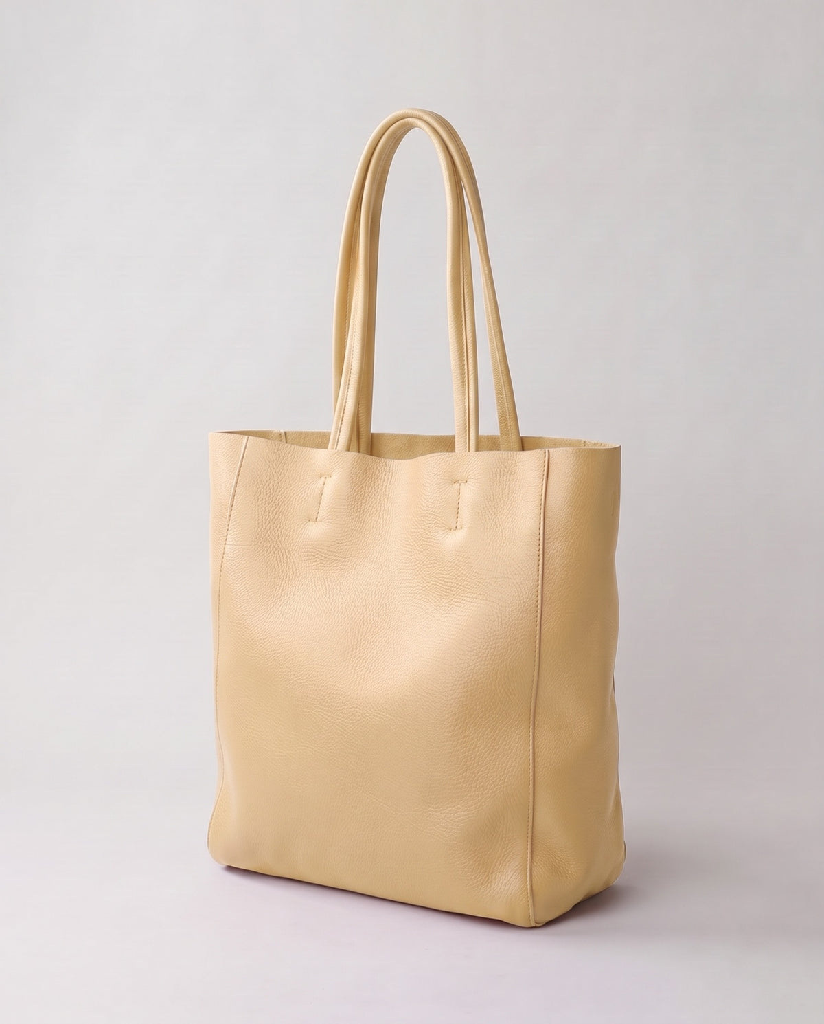 Costa leather tote in cream, three-quarter view