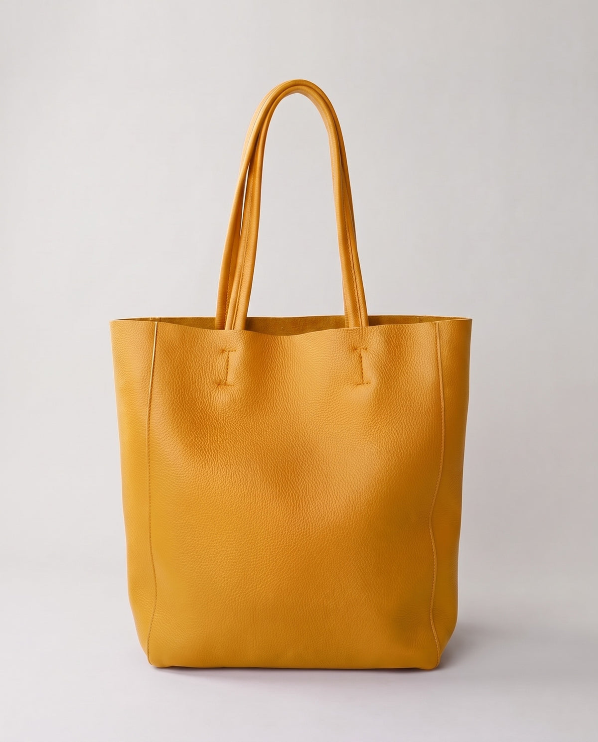 Costa leather tote in mustard, front view