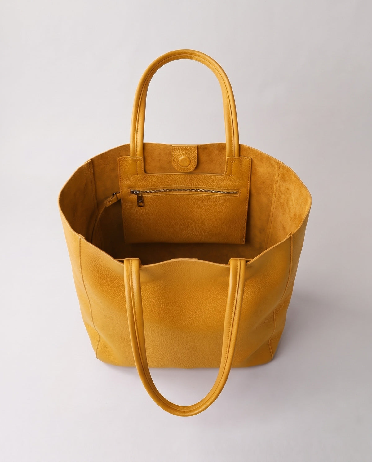 Costa leather tote in mustard, open showing interior
