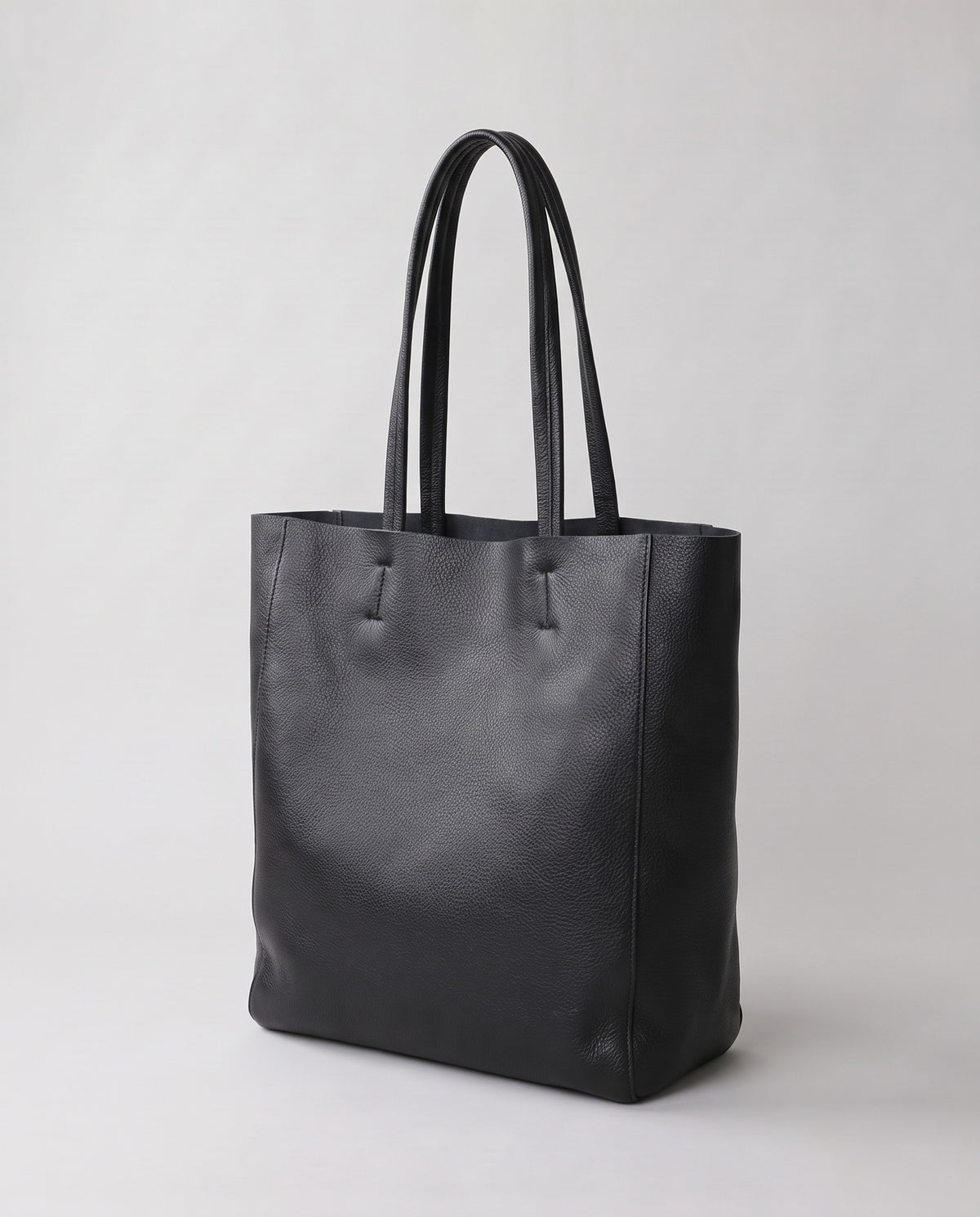 Costa leather tote in onyx, three-quarter view