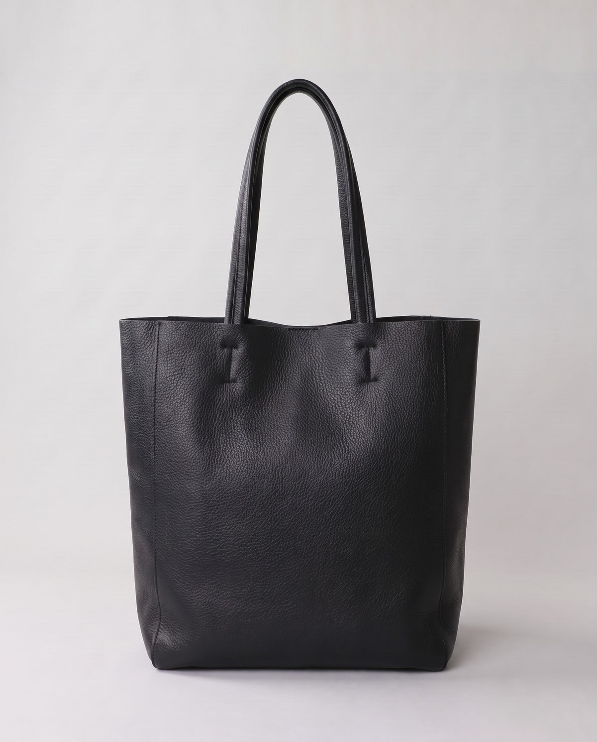 Costa leather tote in onyx, back view