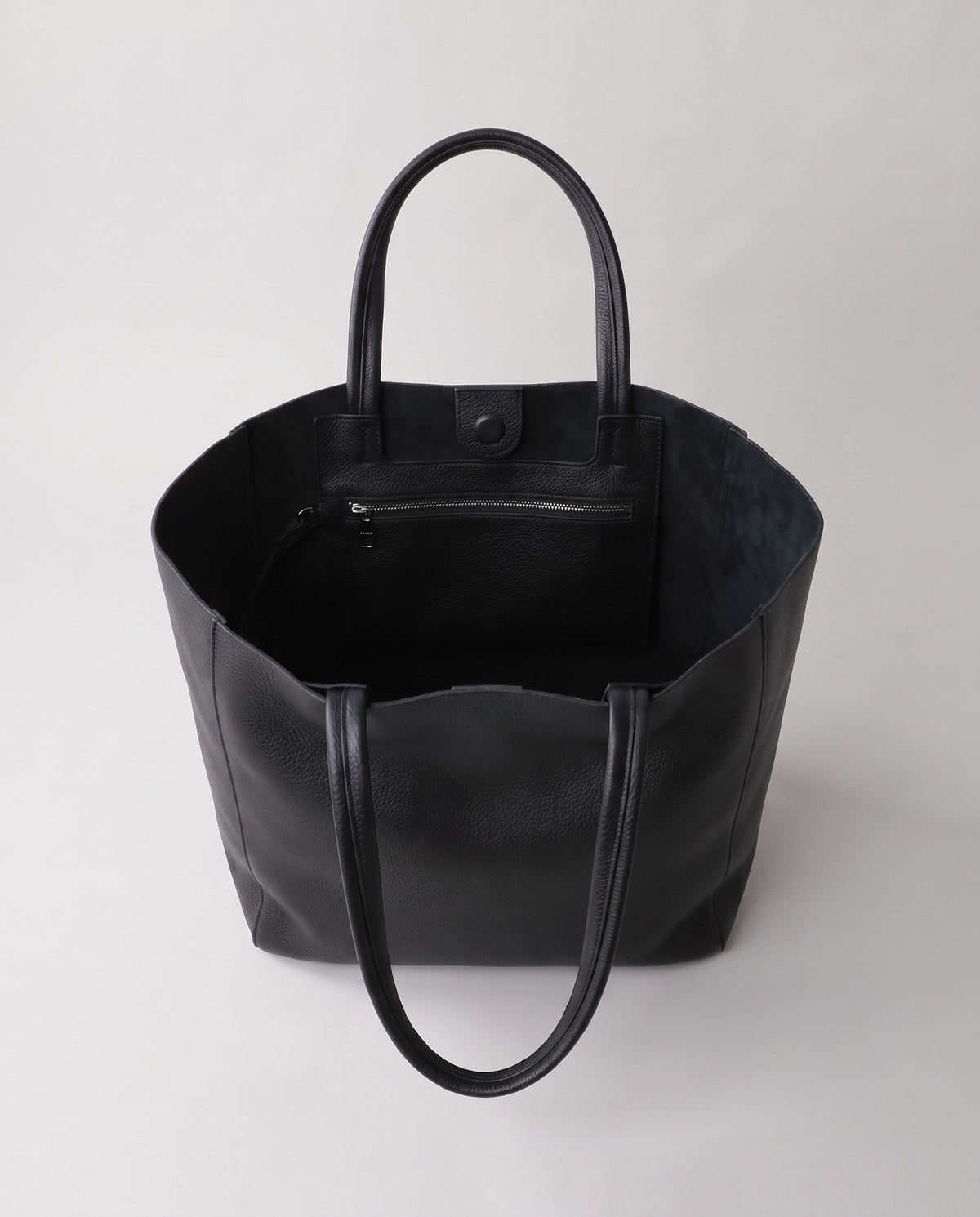 Costa leather tote in onyx, open showing interior