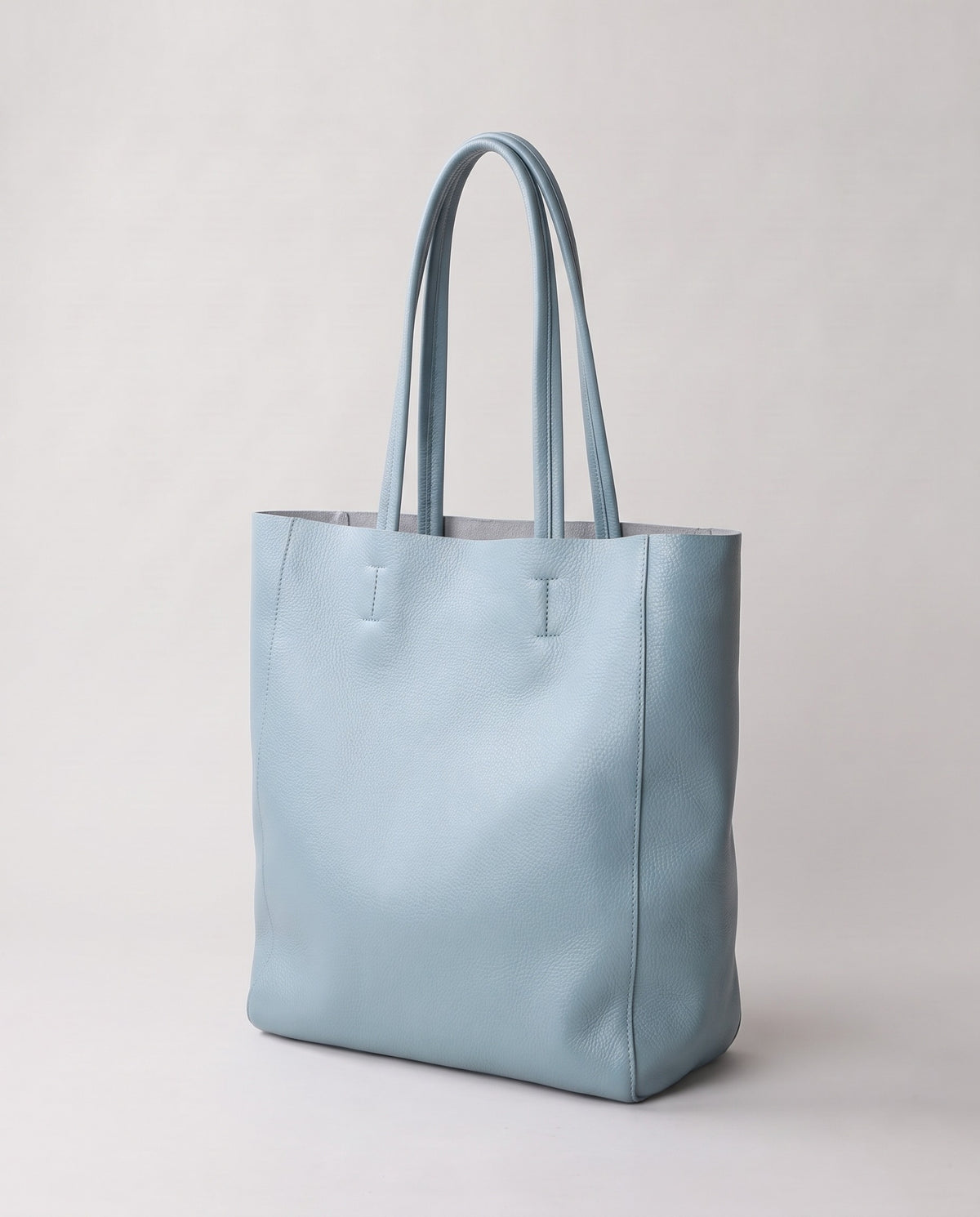 Costa leather tote in sky, three-quarter view