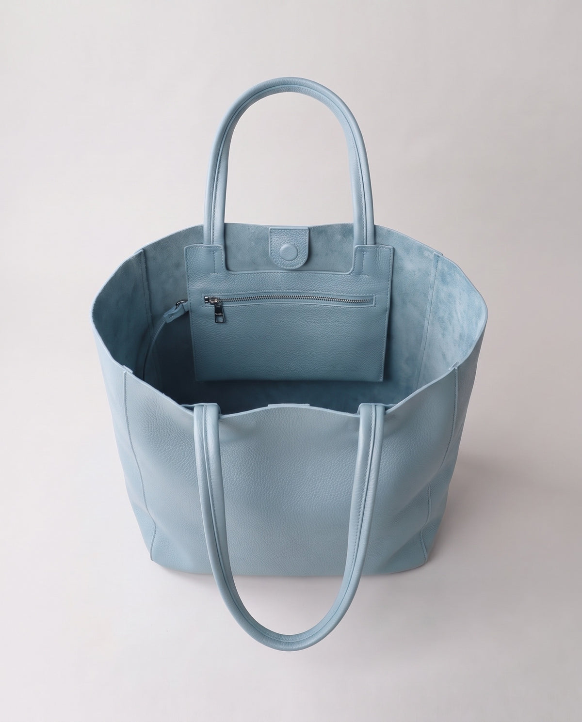 Costa leather tote in sky, open showing interior