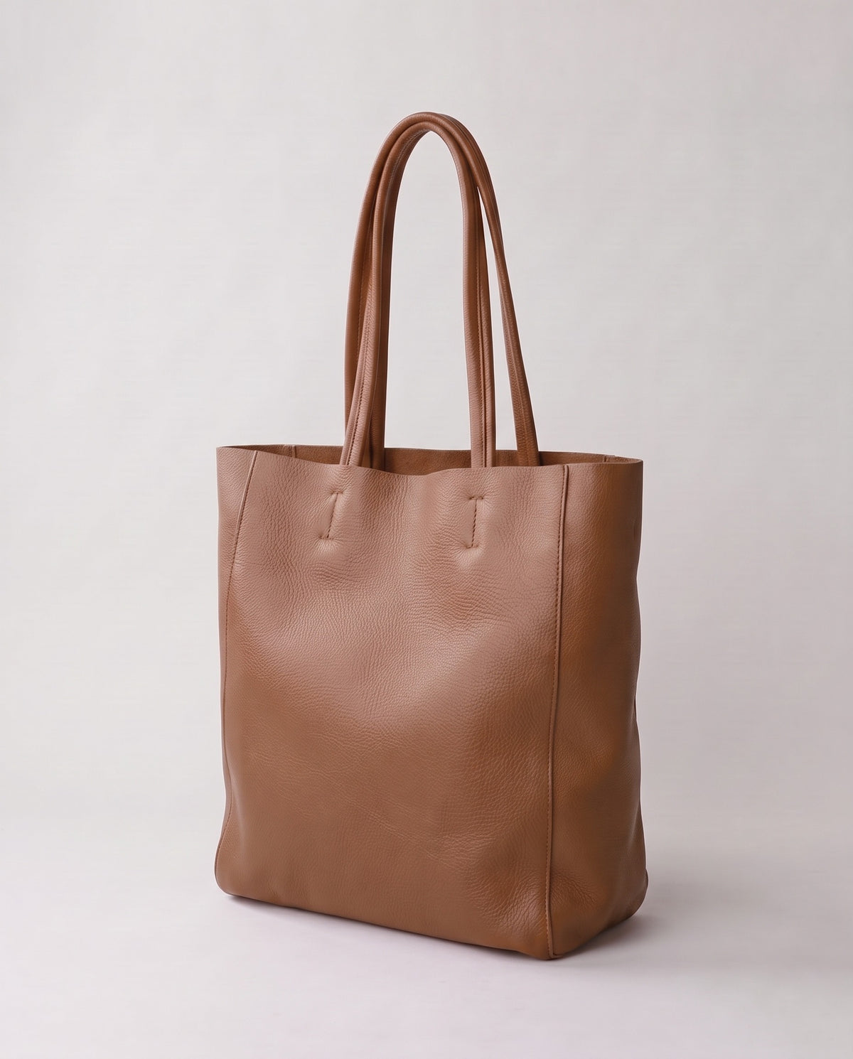 Costa leather tote in taupe, three-quarter view