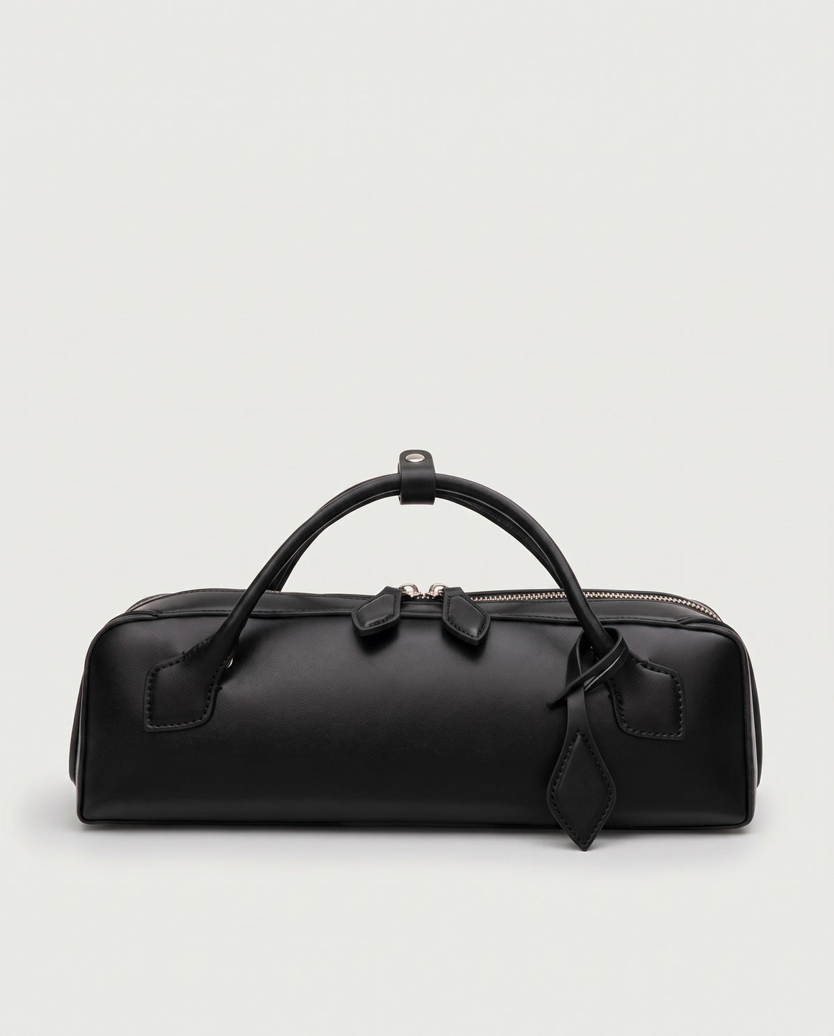 Curve leather barrel bag in Black – front view