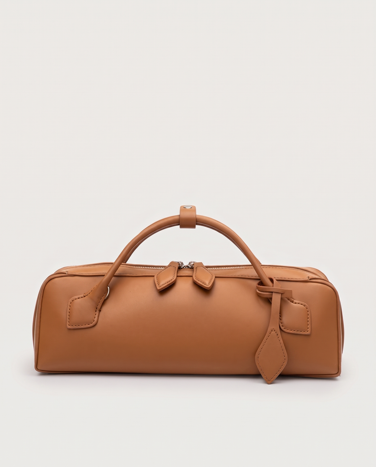 Curve leather barrel bag in Caramel – front view