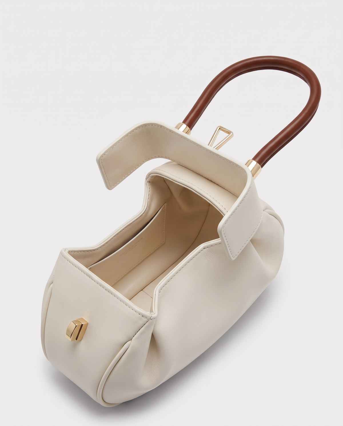 Dumpling Maxi leather top-handle bag in White – open, showing the leather-lined interior