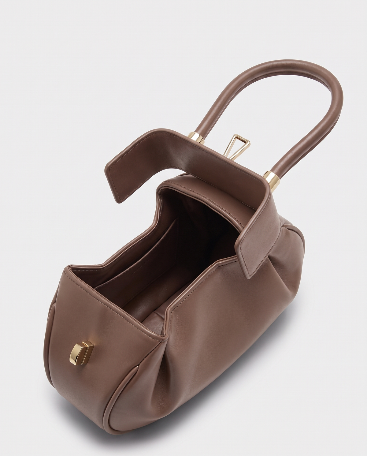 Dumpling Mini leather top-handle bag in Nude – open, showing the leather-lined interior