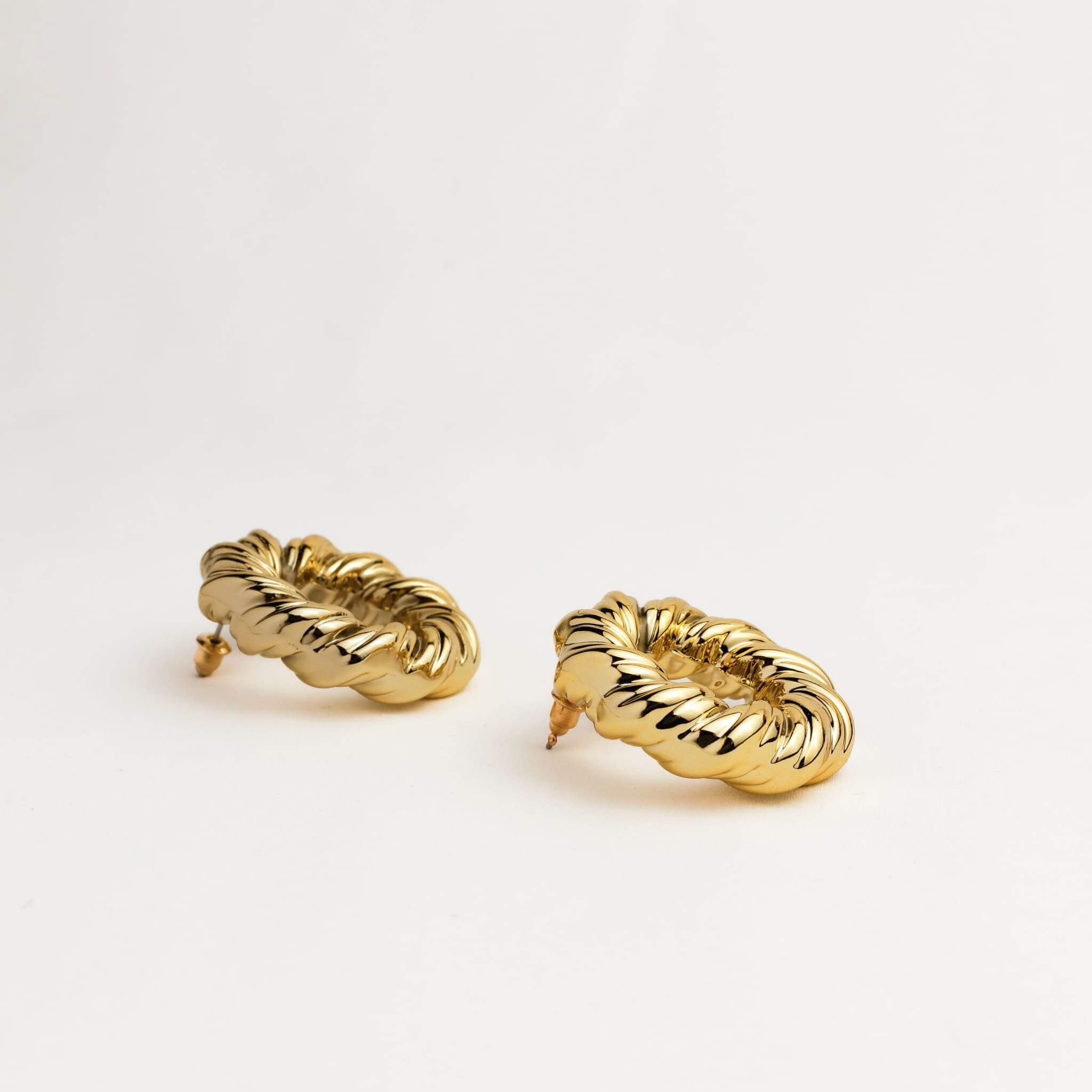 A pair of gold hoop earrings