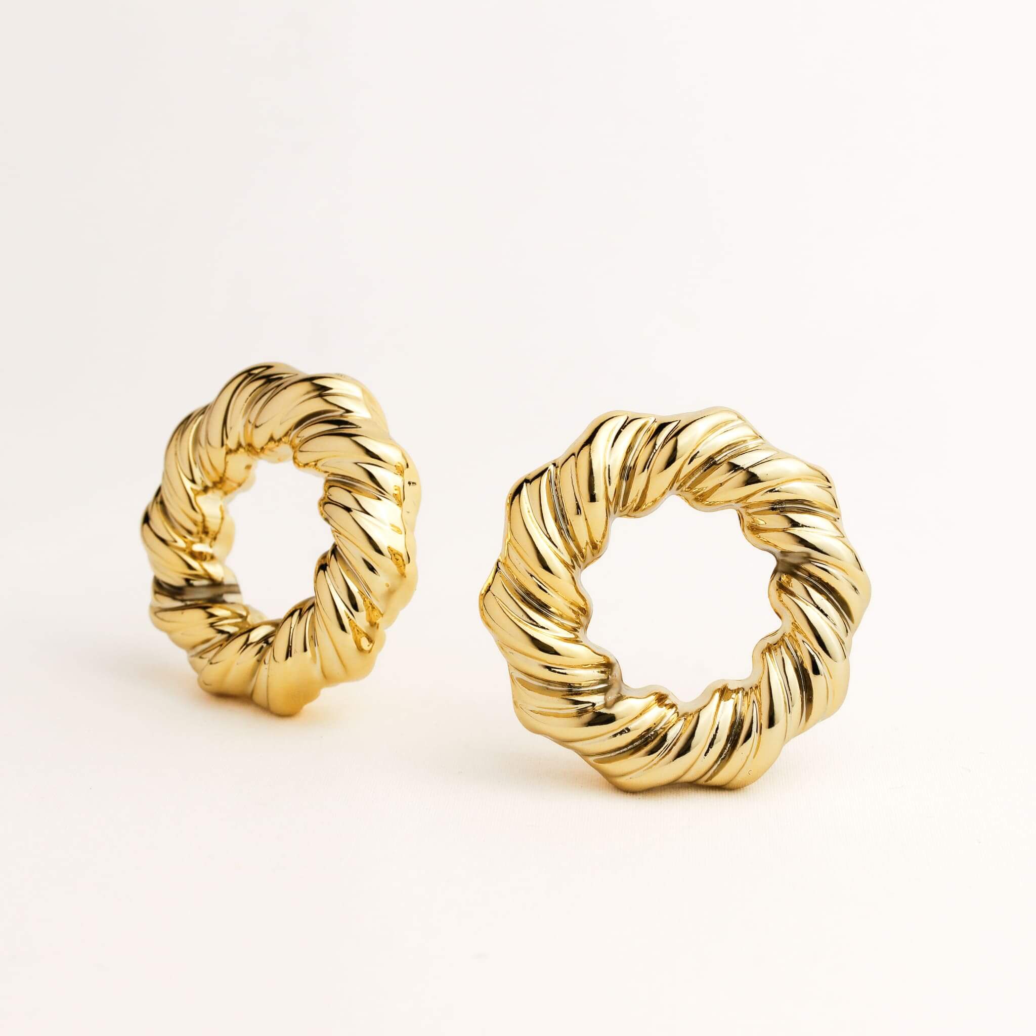 A pair of gold hoop earrings