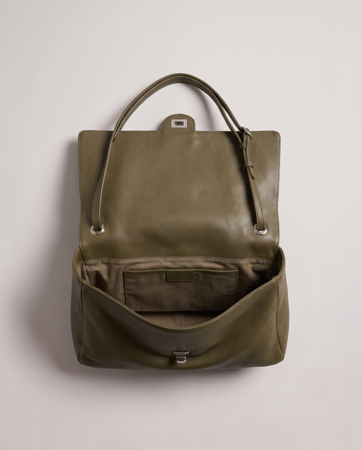 Fiume leather shoulder bag in olive, open showing interior